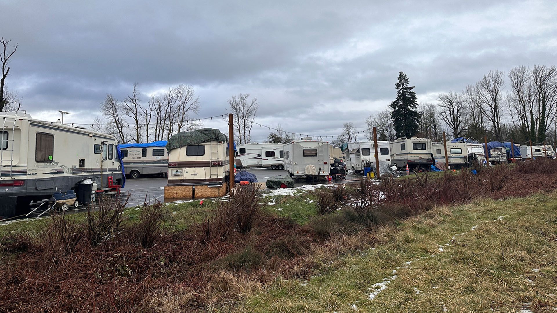Recreational vehicles parked in a lot for unhoused people in North Portland