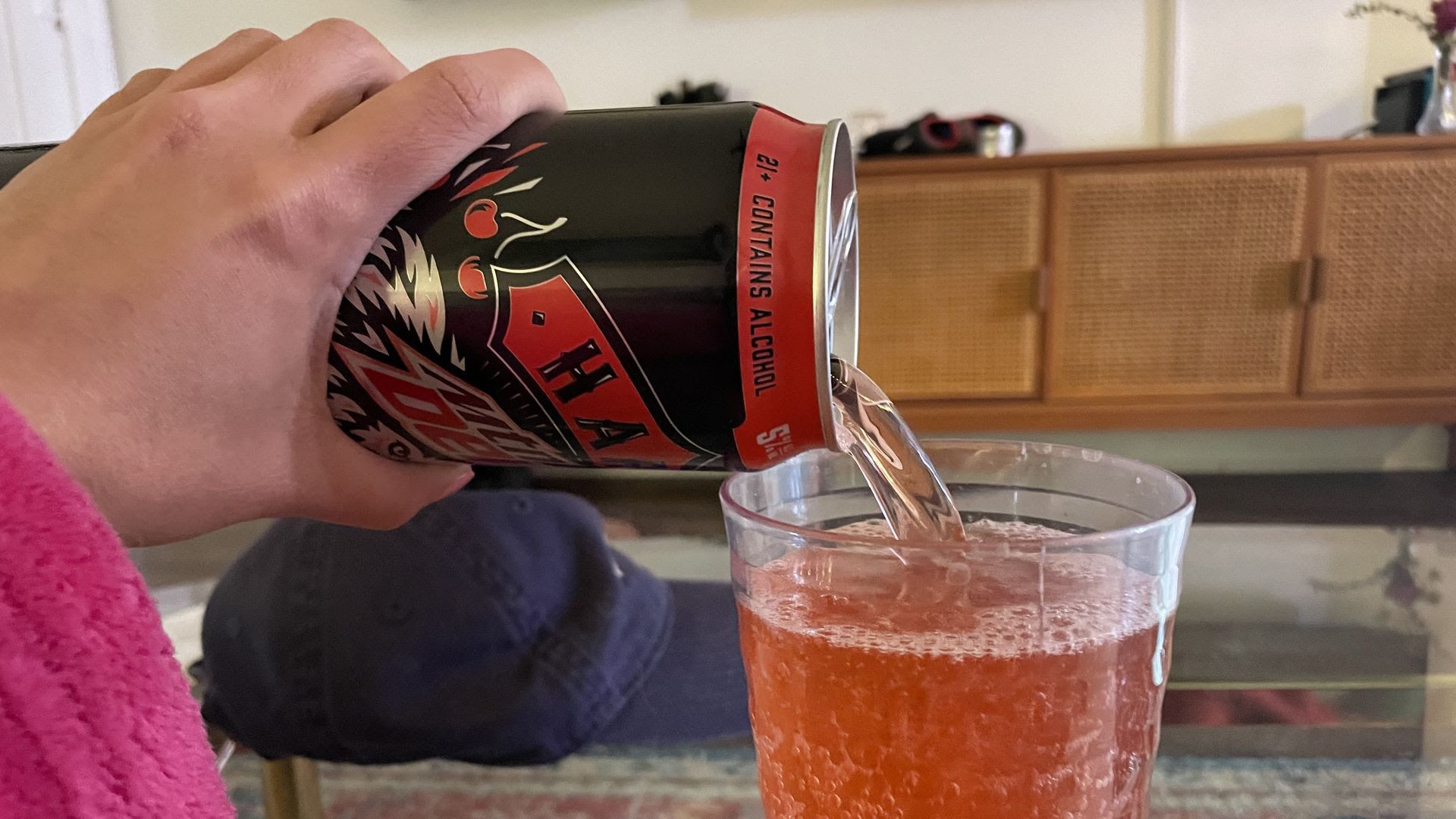 Linh Ta pours a tall, cool glass of red Hard Mtn Dew.