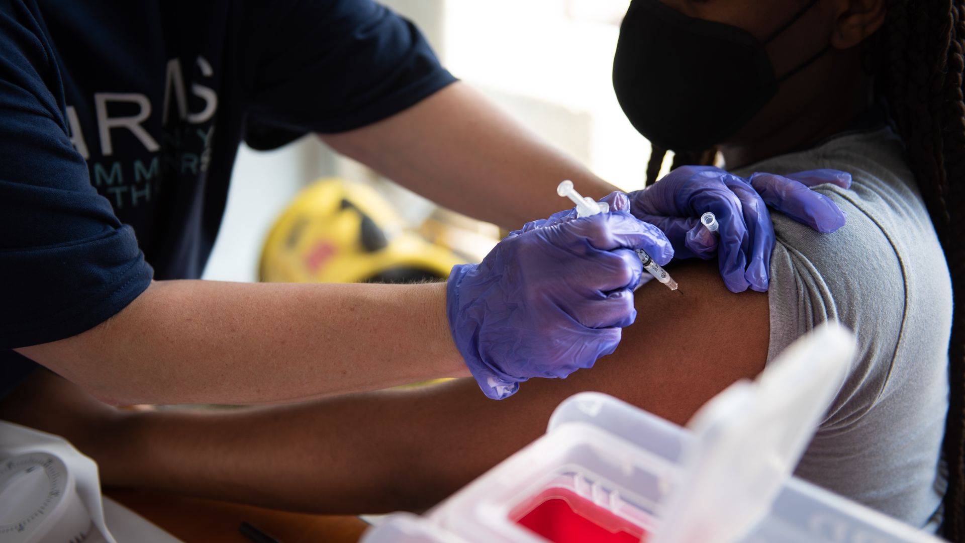 A healthcare worker administers a dose of the Pfizer-BioNTech Covid-19 vaccine during a vaccination event in Birmingham, Alabama, U.S.
