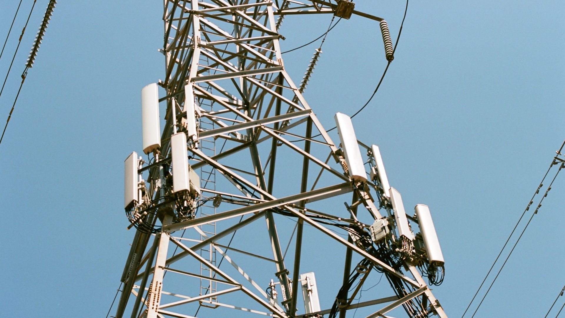 Close-up of the metal base of a cell phone tower.