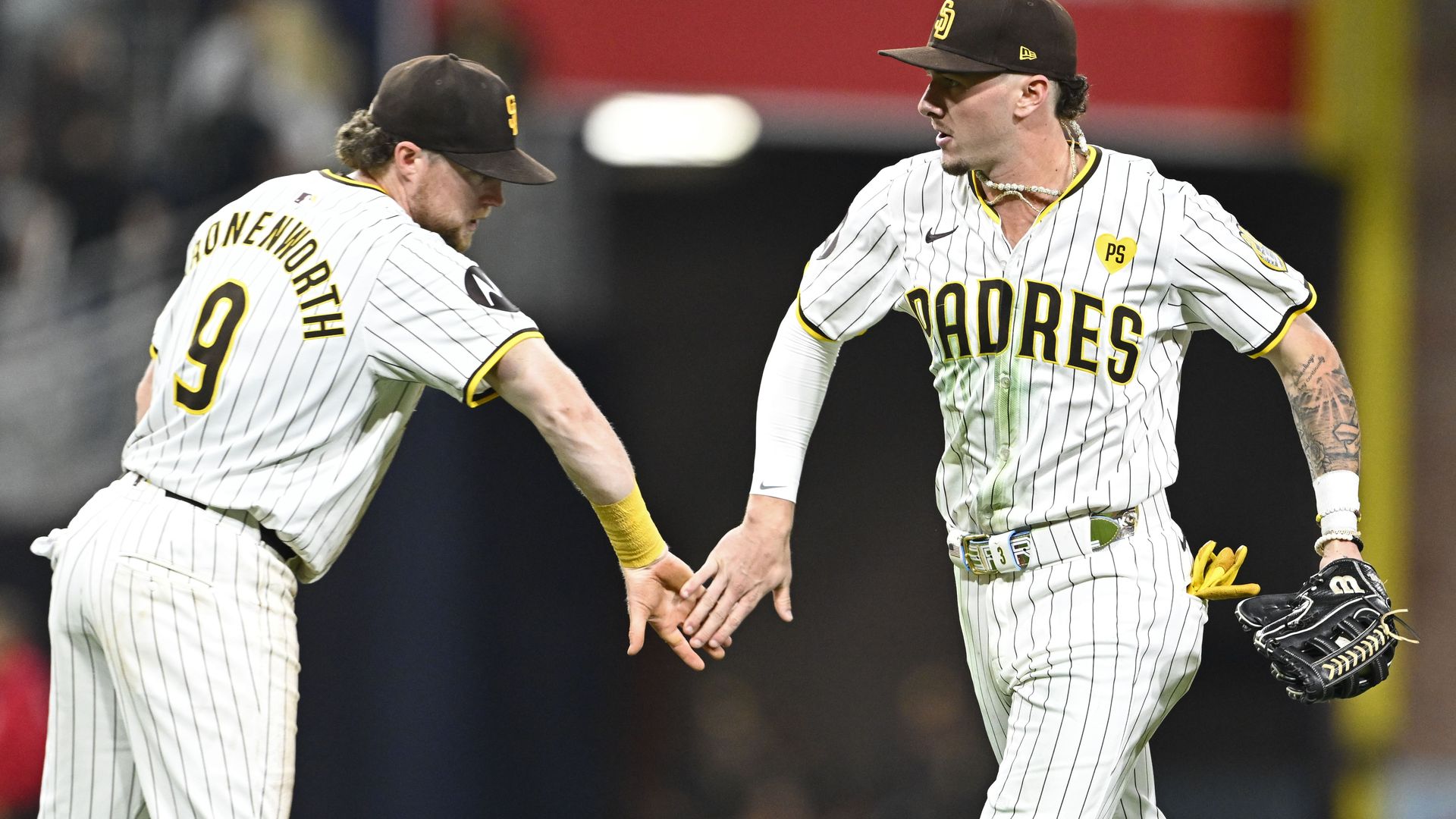 Jackson Merrill and Jake Cronenworth celebrate