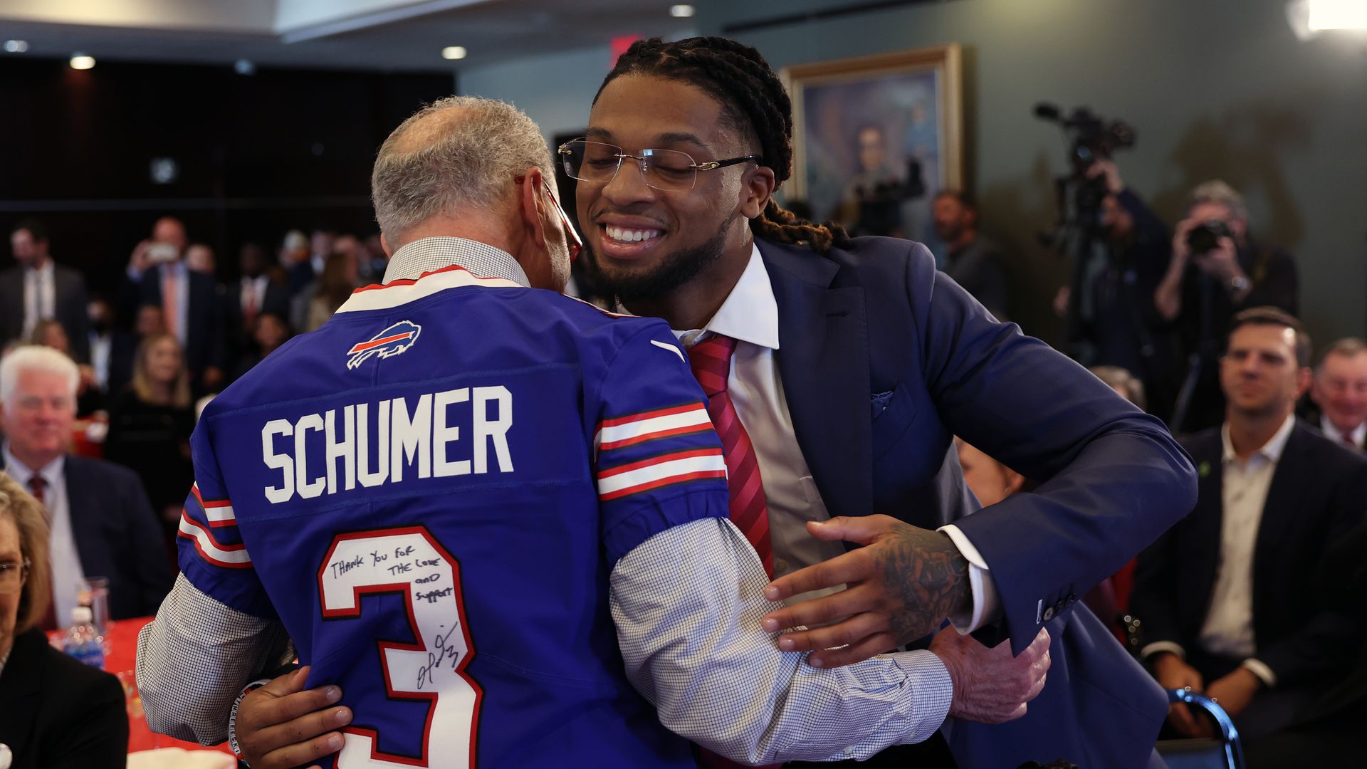 Chuck Schumer and Damar Hamlin