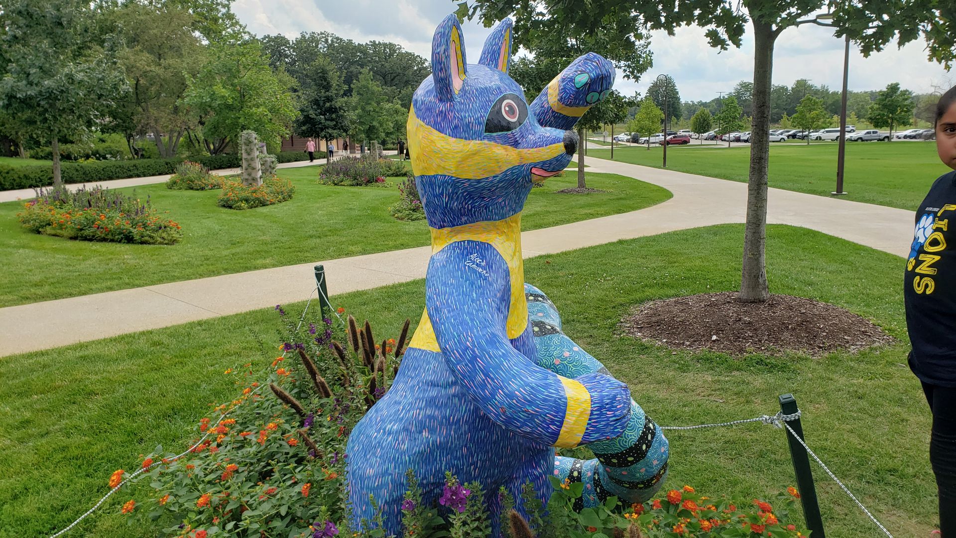 A colorful animal sculpture in a garden