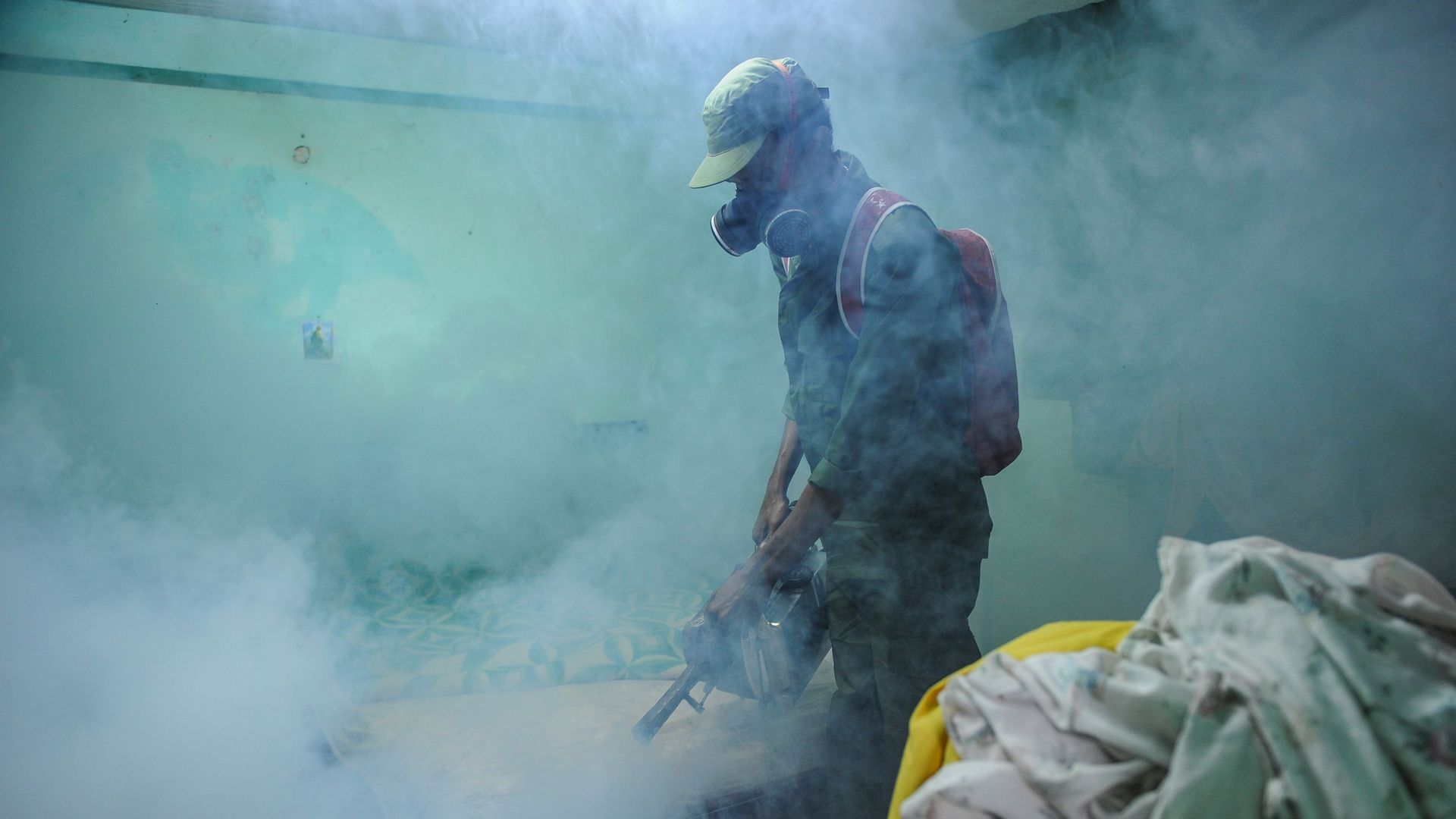 Member of the Cuban army fumigates against mosquitoes following Zika outbreak
