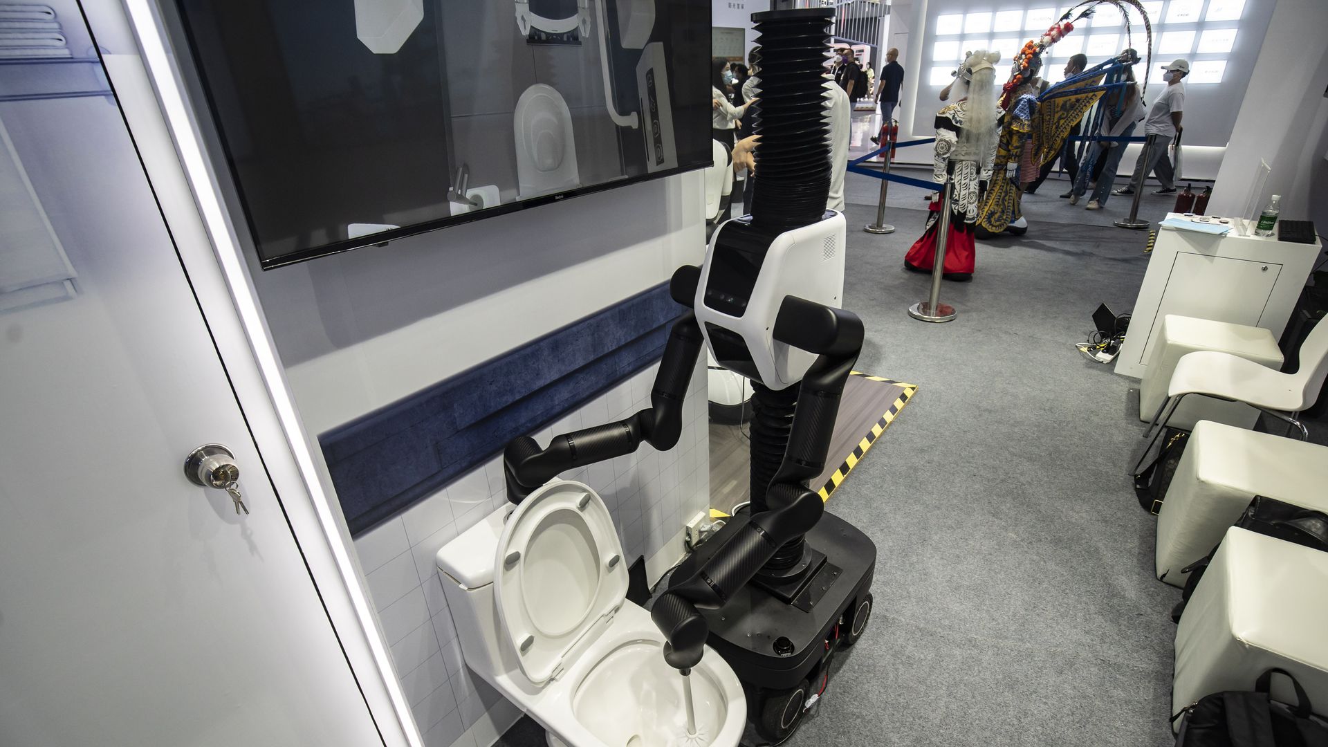  A robot scrubs a toilet at the World Artificial Intelligence Conference (WAIC) in Shanghai, China, on Friday, Sept. 2, 2022. 