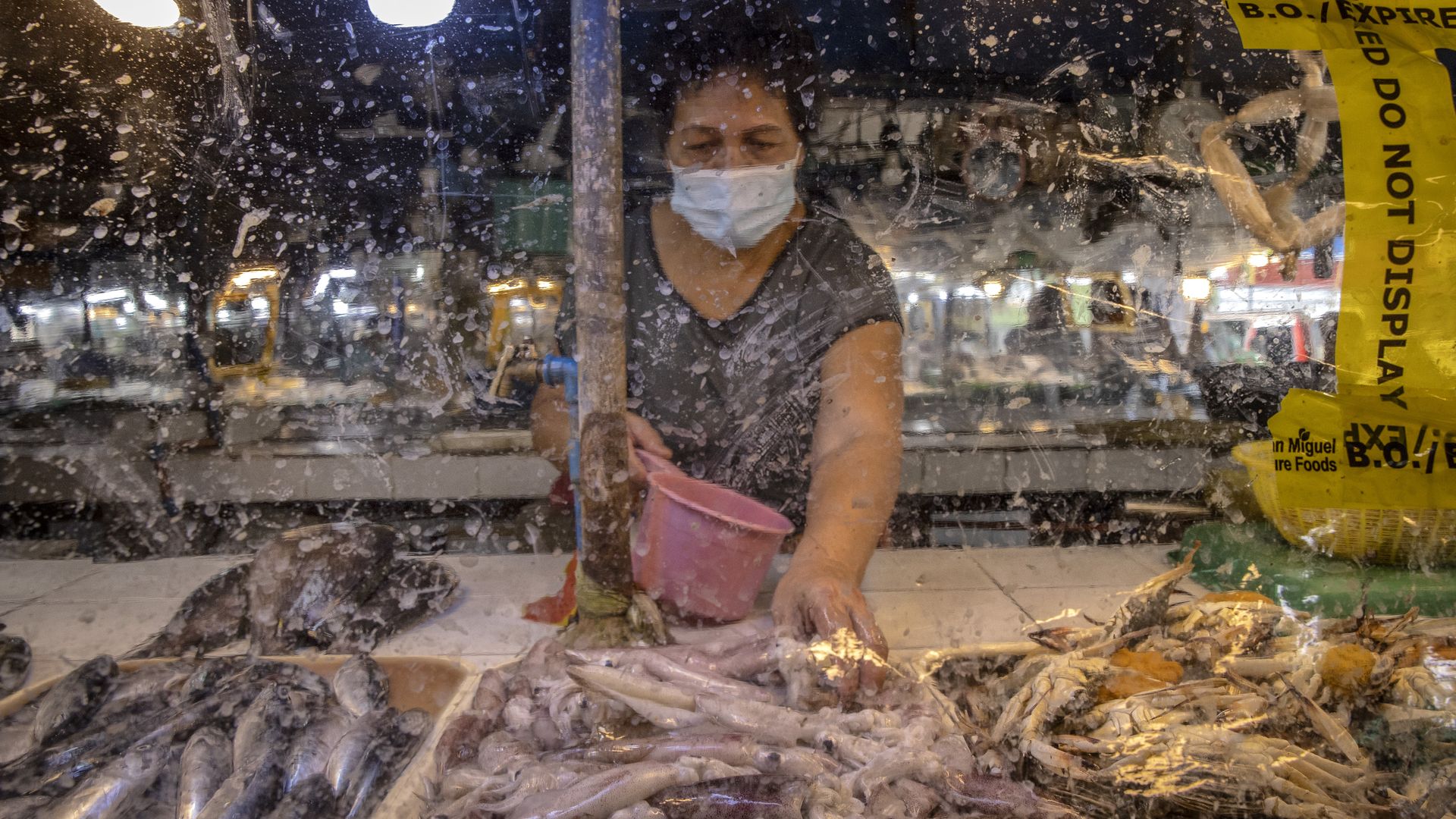 A woman at a wet market in the Philippines.