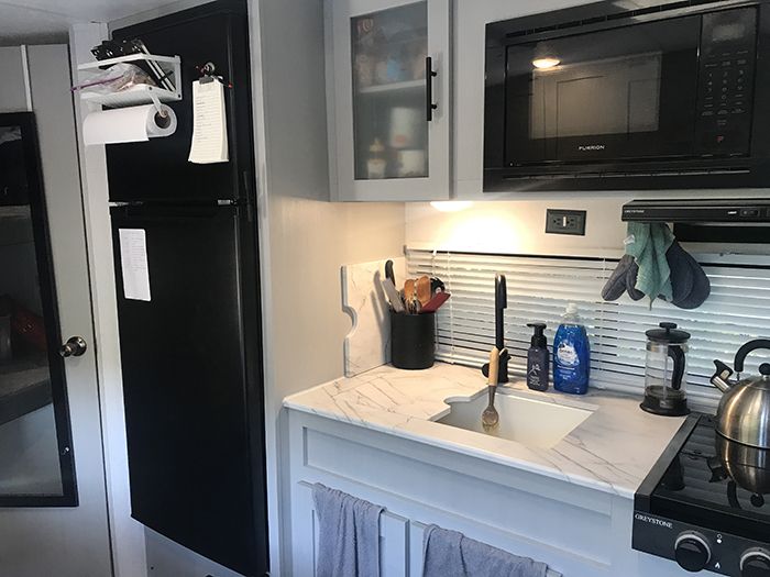 Shane Cordileone and Alexandria Beesting's camper kitchen area, camper, van life, nomad, Charlotte