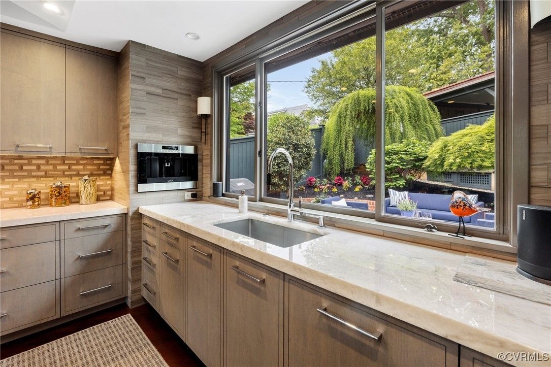 A kitchen with a garden view