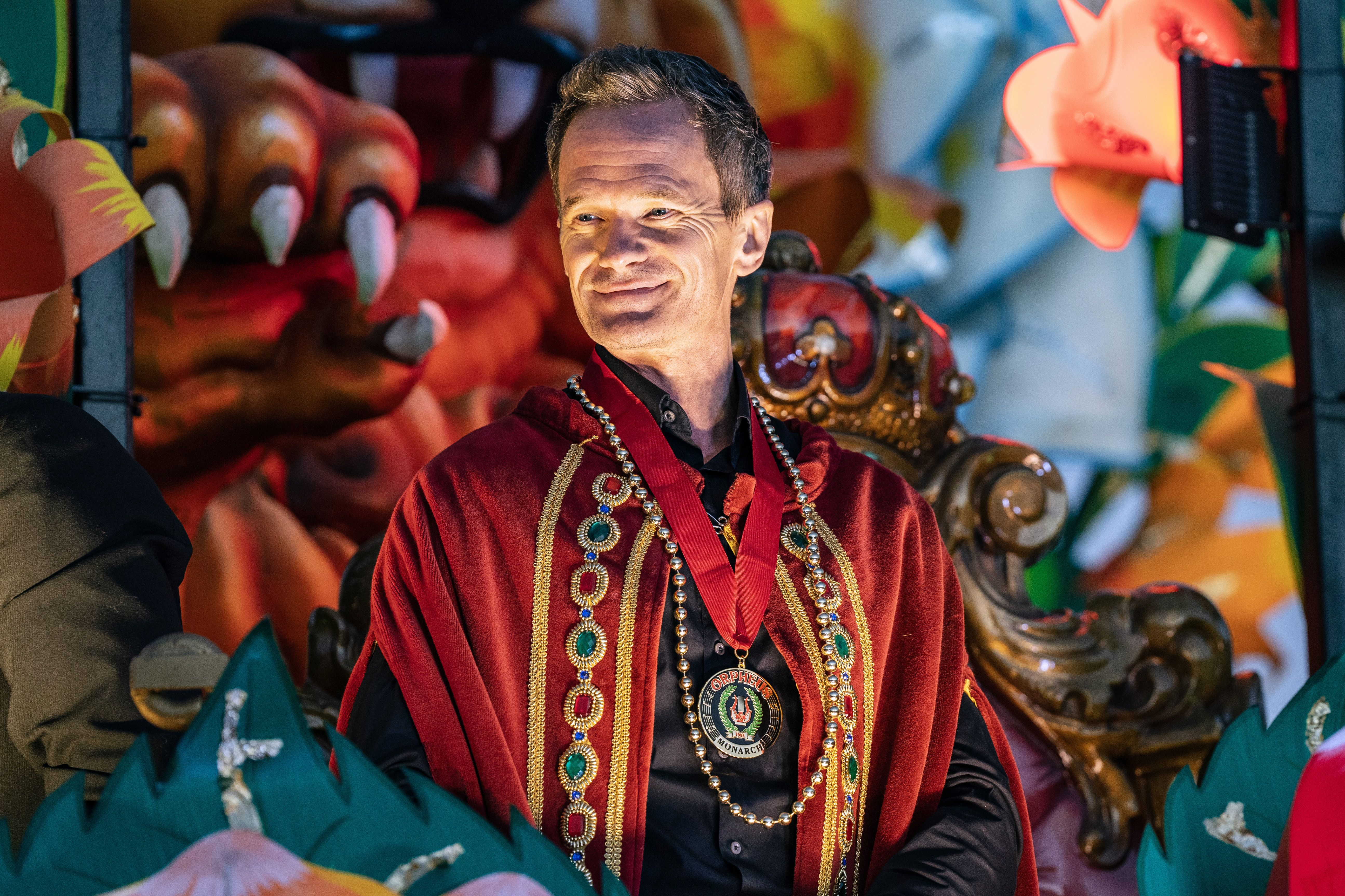 Photo shows Neil Patrick Harris on a float in the Krewe of Orpheus