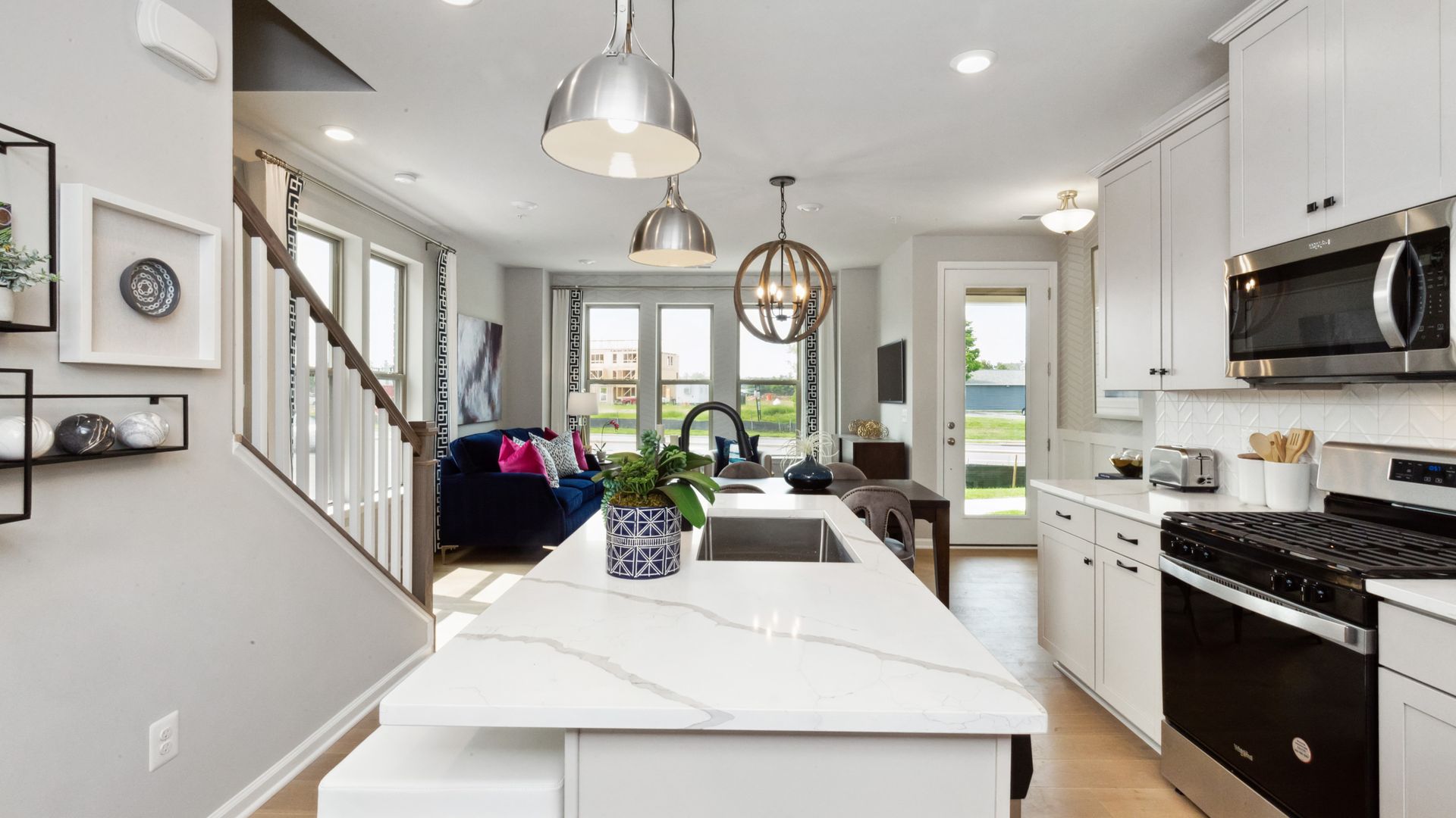 A kitchen and open-concept living room.