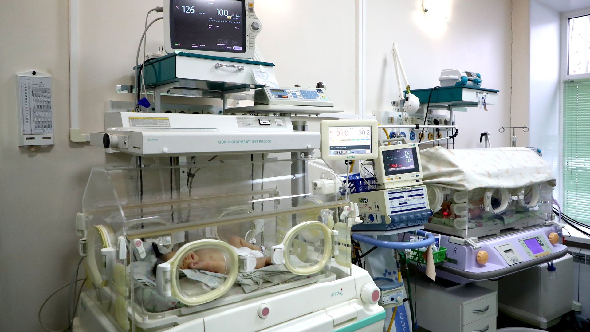 A newborn baby in the intensive care unit 