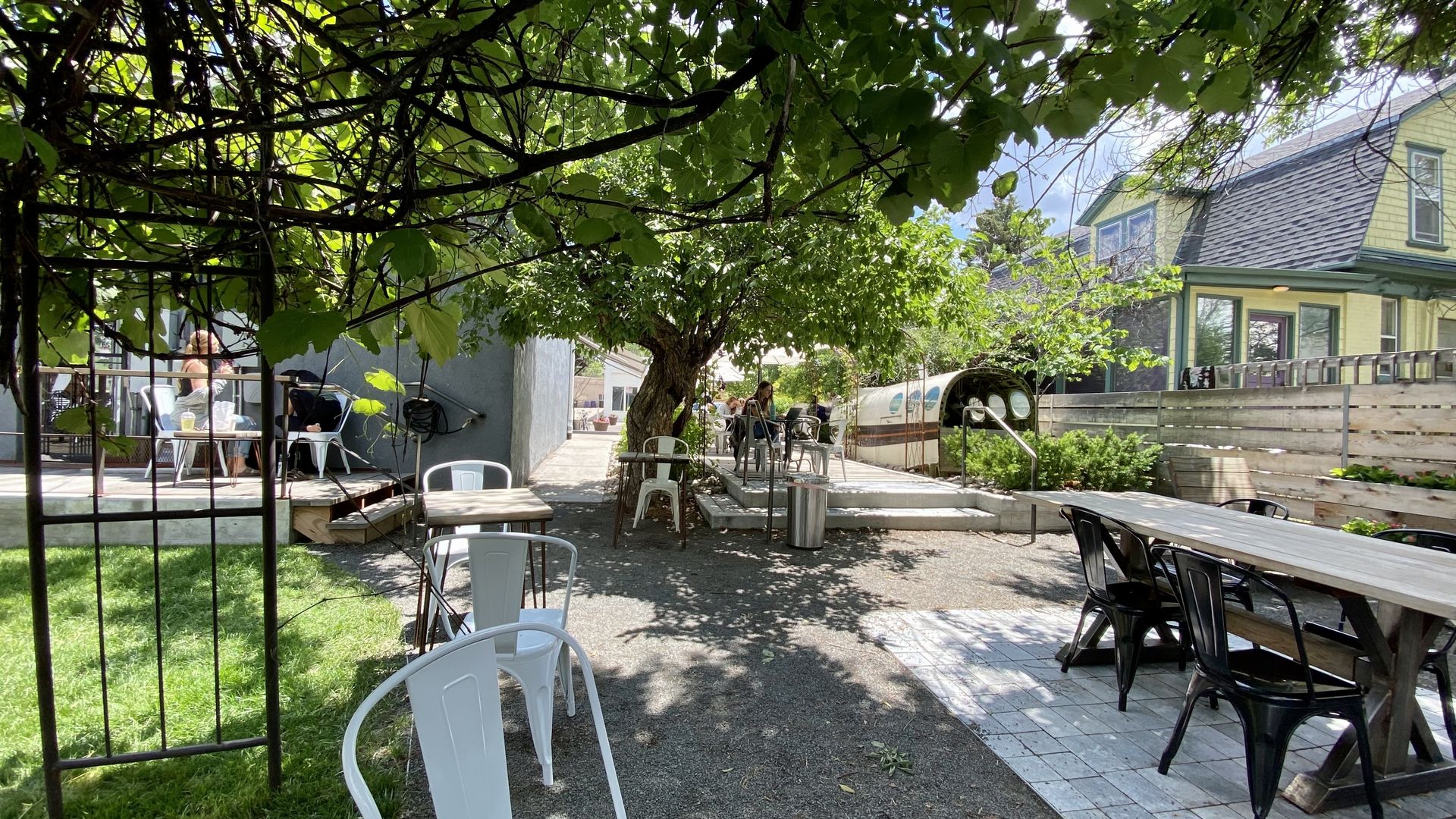 A coffee patio with lots of greenery 