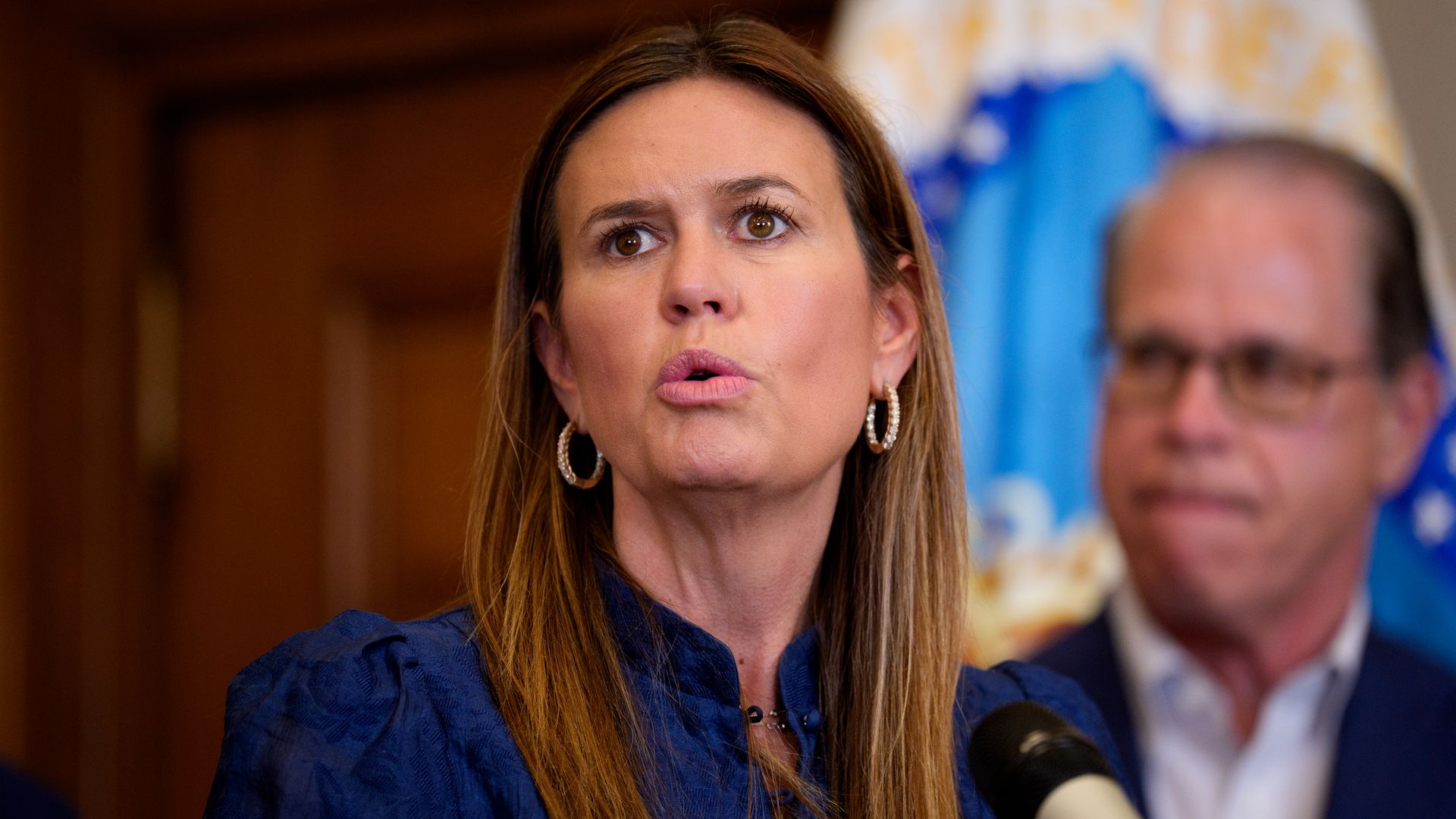 Arkansas Gov. Sarah Huckabee Sanders speaks before U.S. Agriculture Secretary Brooke Rollins signs three new SNAP food choice waivers for the states of Idaho, Utah, and Arkansas in her office at the United States Department of Agriculture Whitten Building on June 10, 2025.