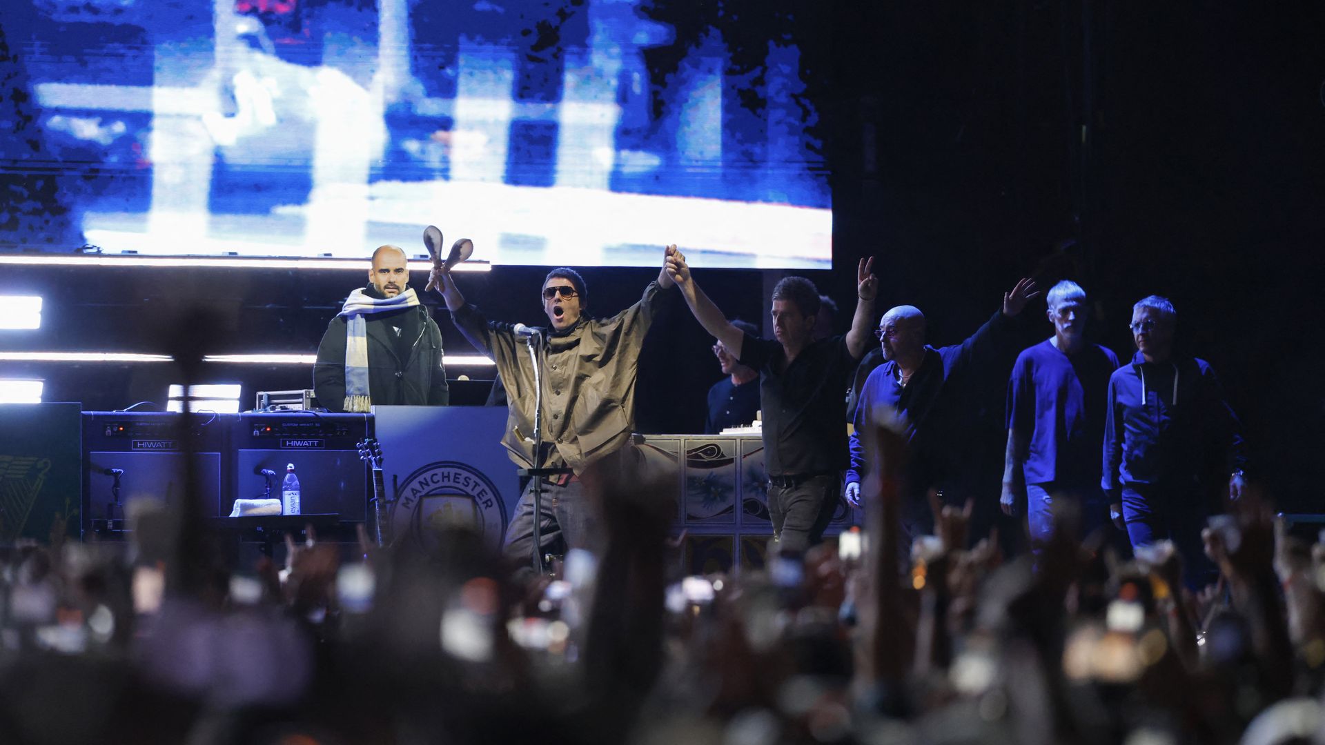 Oasis onstage during their Chicago concert earlier this year.