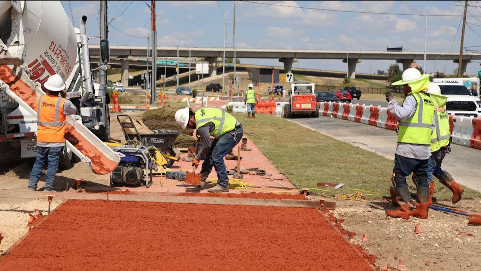 A crew does construction along Austin's Airport Boulevard