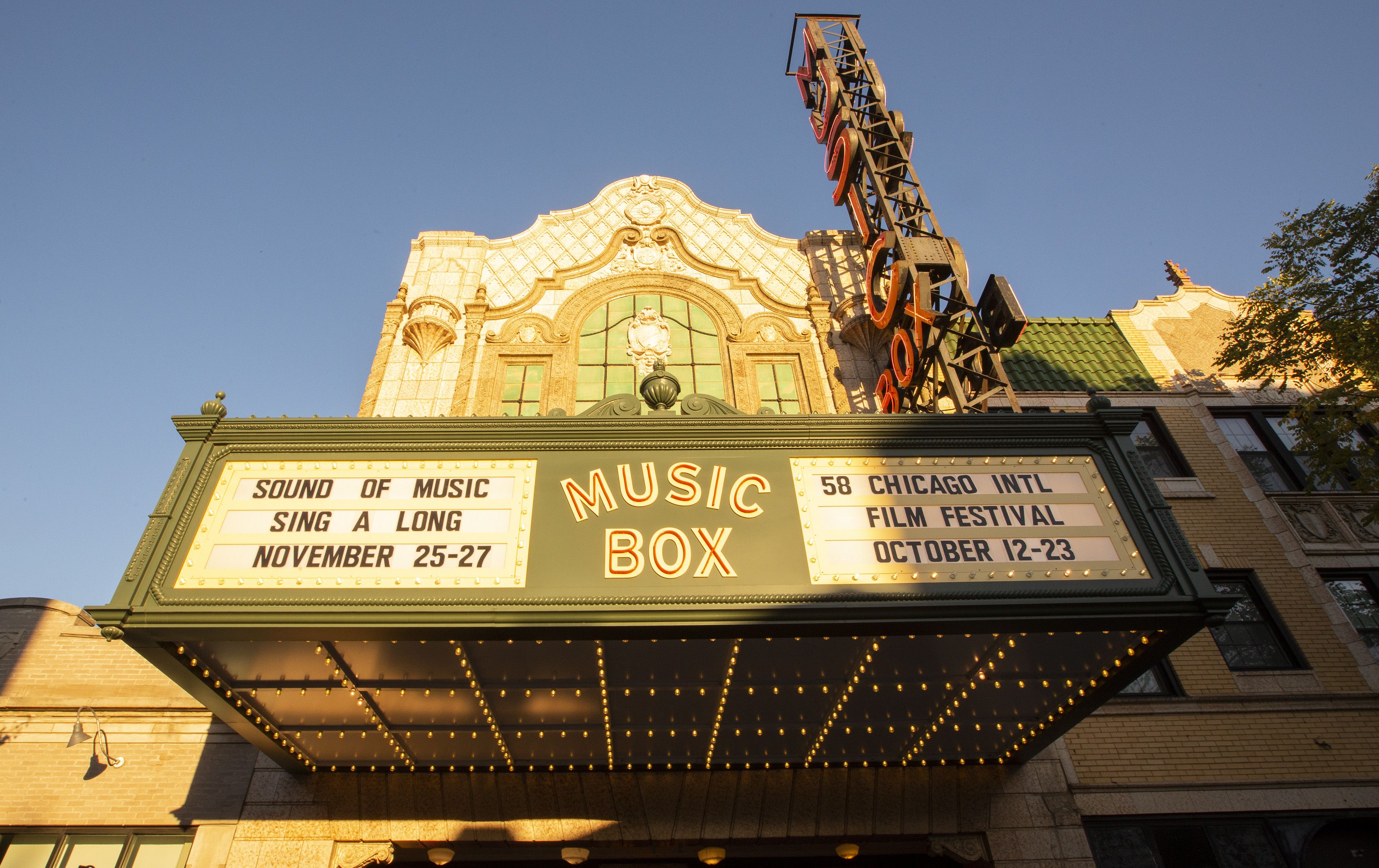 Photo of the front of a theater and its marquee.