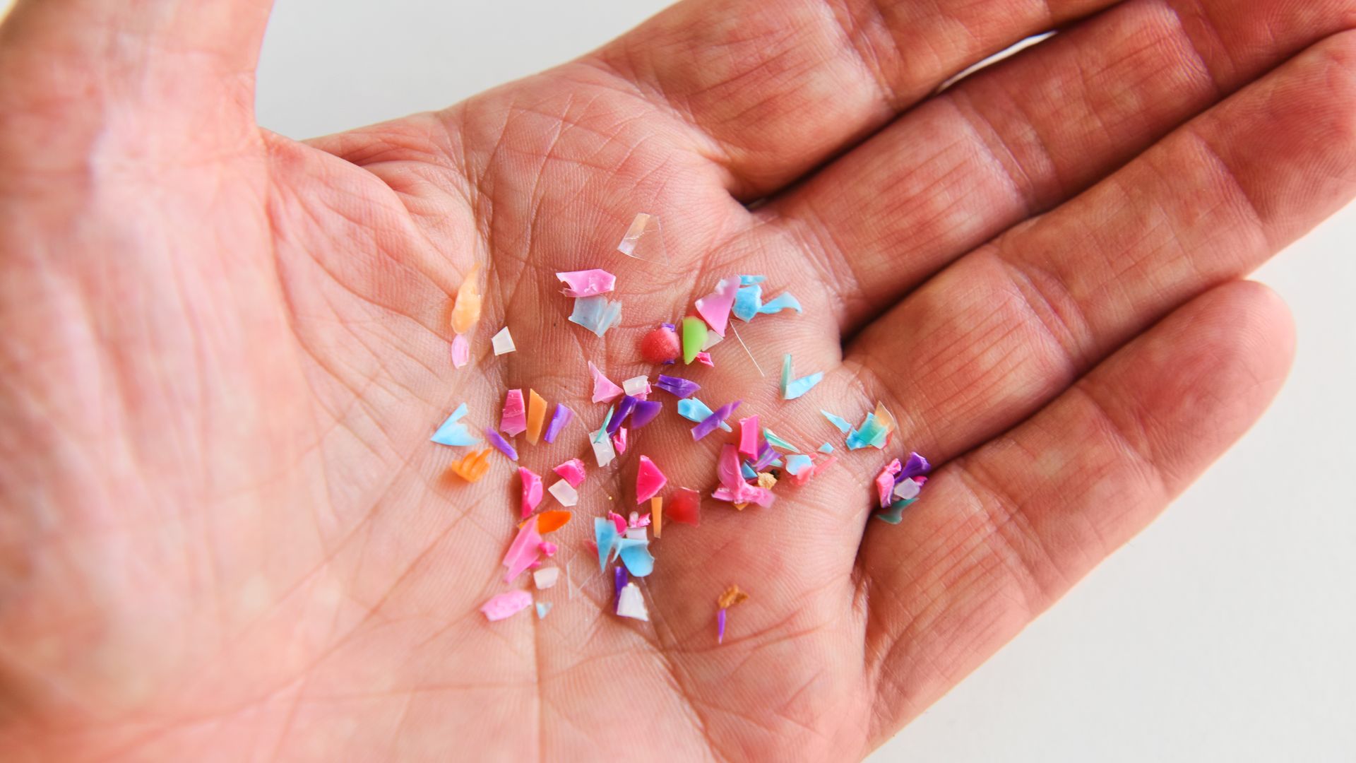  In this photo illustration, fragments of plastic are held in an adult hand on December 20,2024 in London, England. 