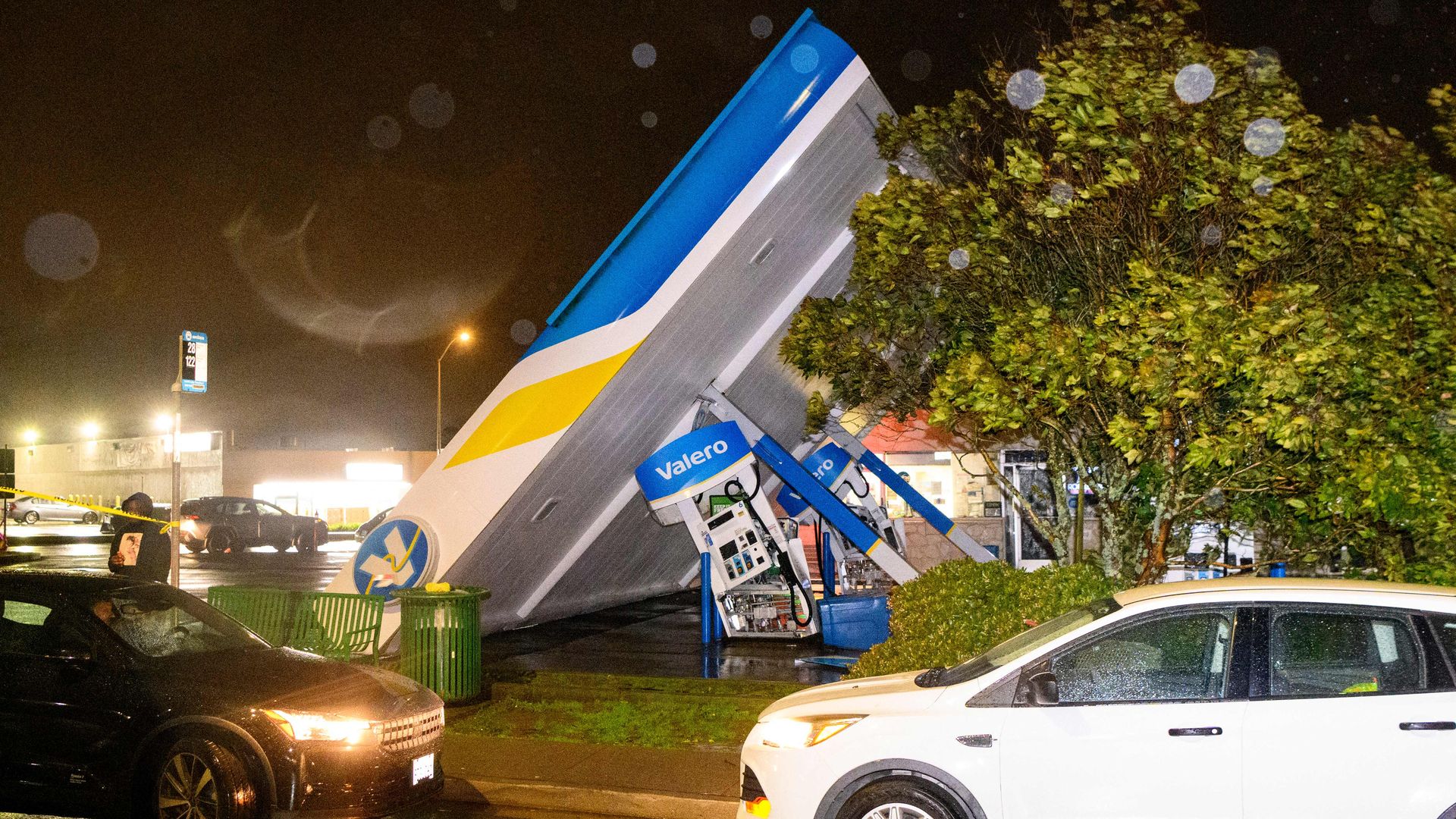 A damaged Valero gas station creaks in the wind during a massive "bomb cyclone" rain storm in South San Francisco, California on January 4, 2023. 