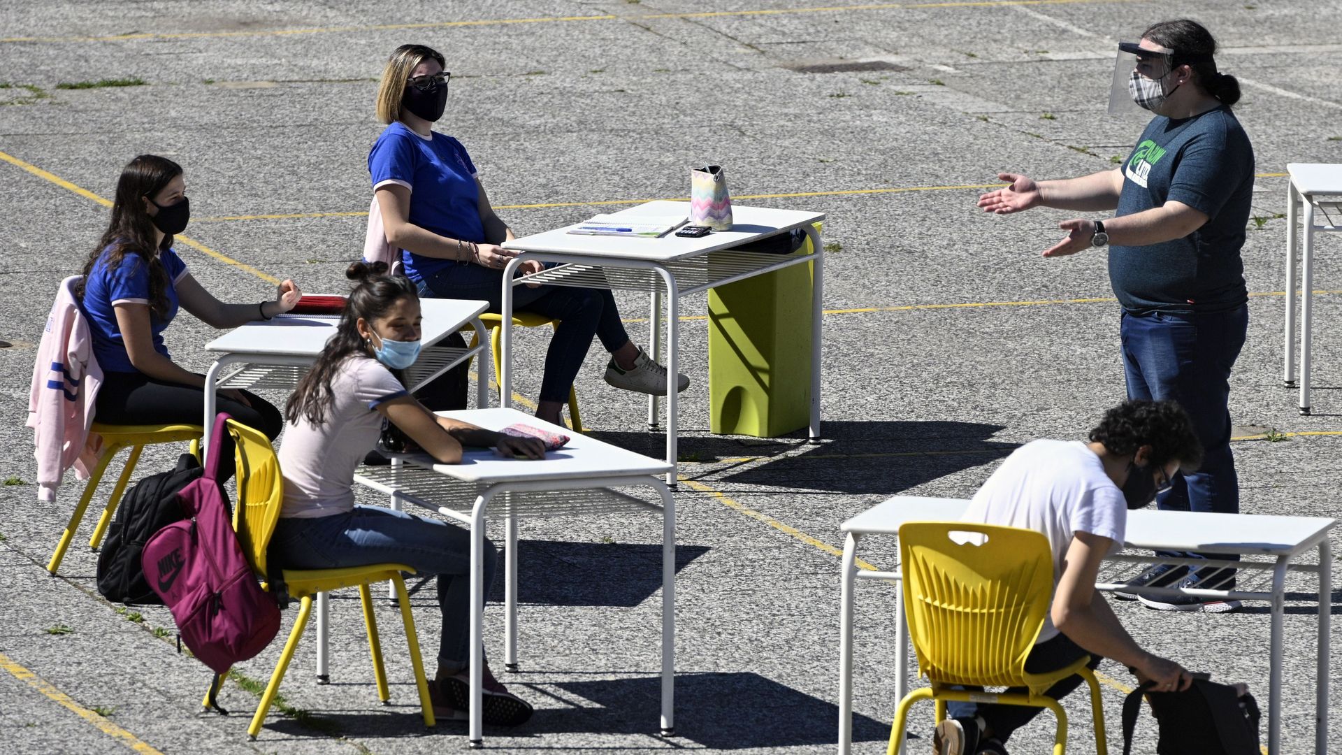 High school students in their last year, attend classes at an improvised classroom in the yard of their school in Buenos Aires, Argentina, on October 13