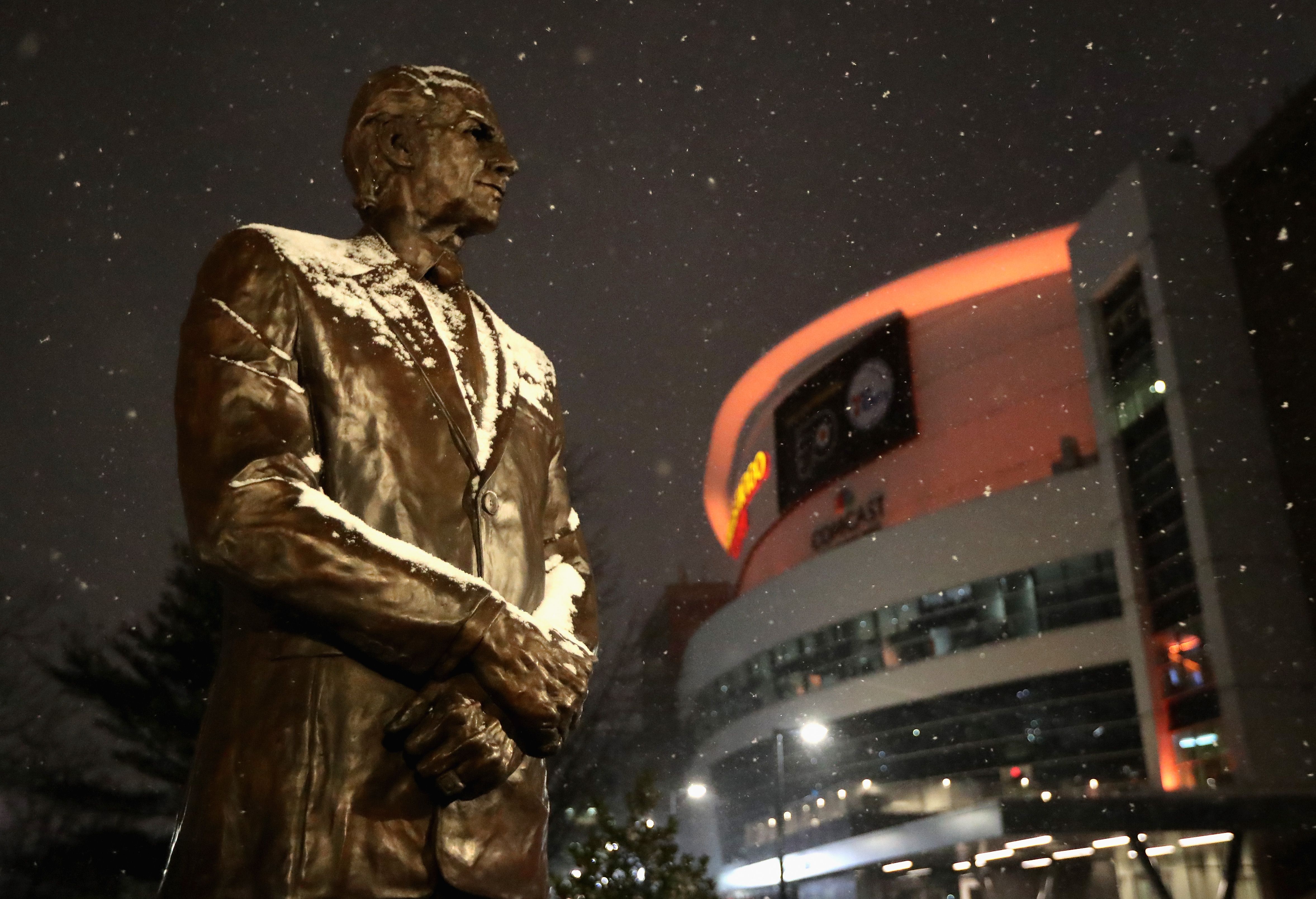 Snow falls on the statue of former Philadelphia Flyers owner and COO Ed Snider at the Wells Fargo Center on January 31, 2021 in Philadelphia, Pennsylvania. 