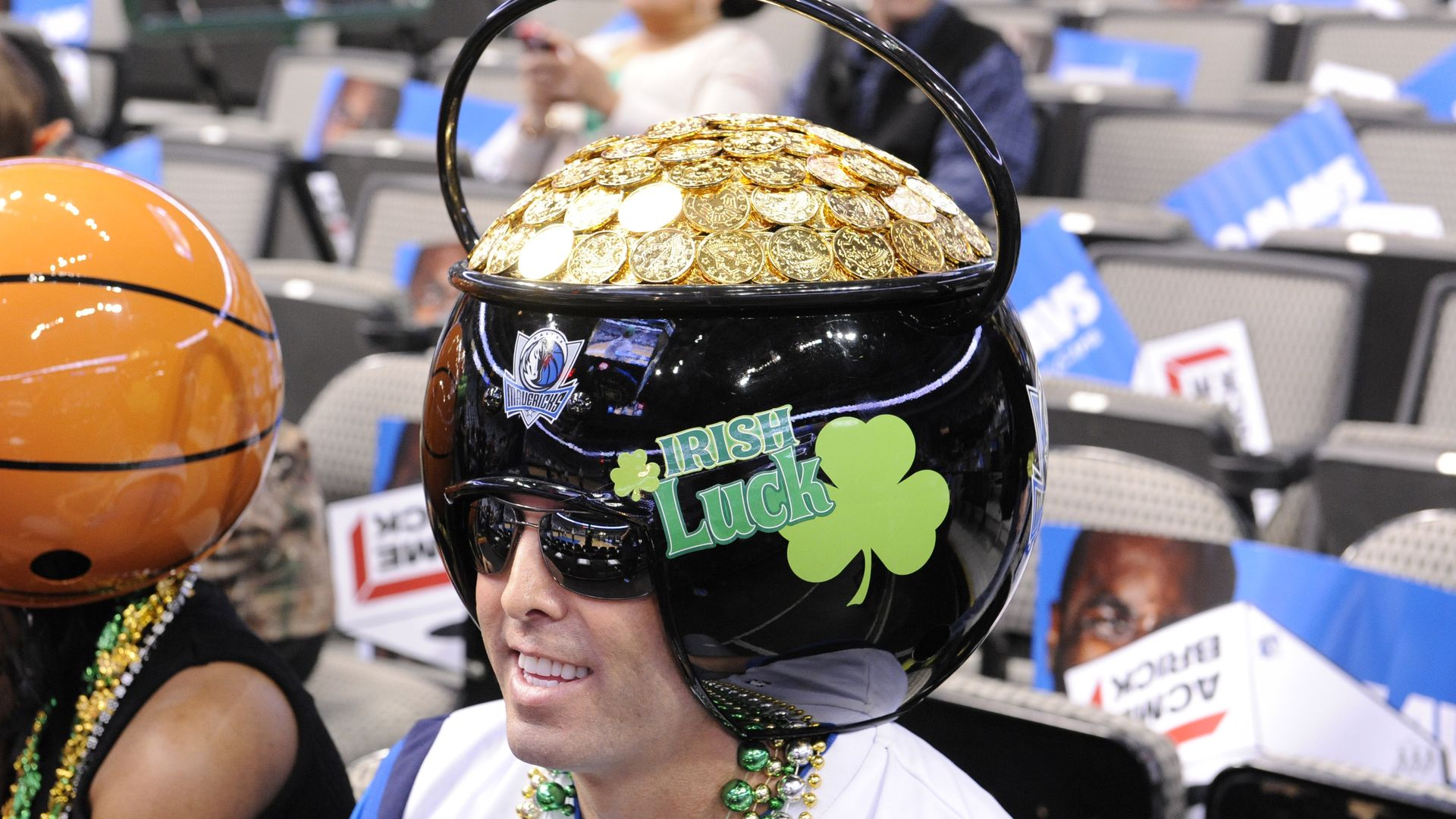 A photo of a man wearing a pot of gold helmet at the American Airlines Center