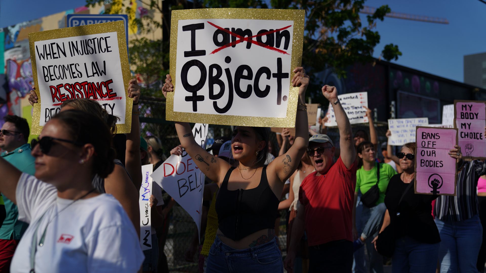 People march together to protest the Supreme Court's decision in the Dobbs v Jackson Women's Health case on June 24, 2022 in Miami, Florida.