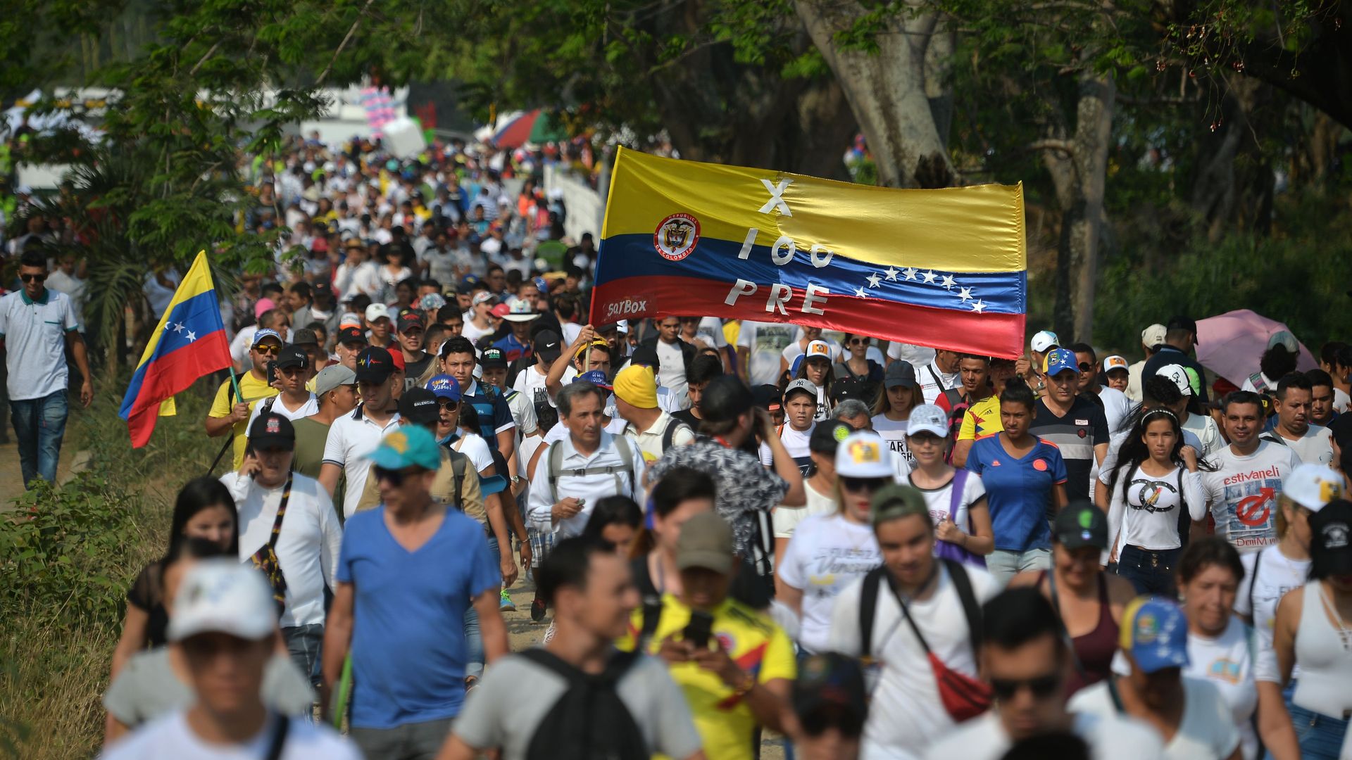 People arrive at the location of a 'Venezuela Aid Live' concert