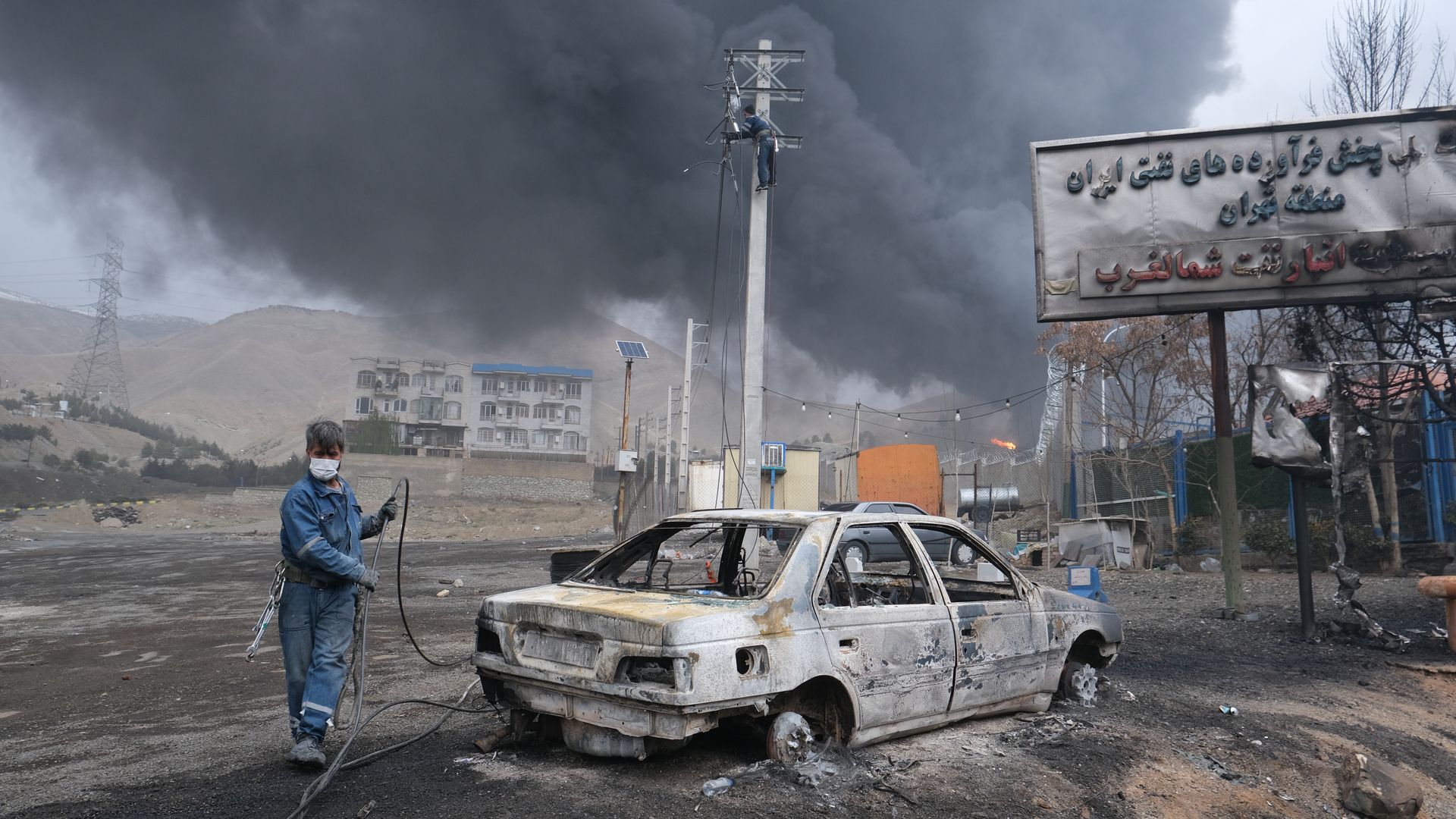 Plumes of smoke rise over the oil depot tanks hit by joint Israel-U.S. over night in a station north west of the capital on March 8, 2026 in Tehran, Iran. 