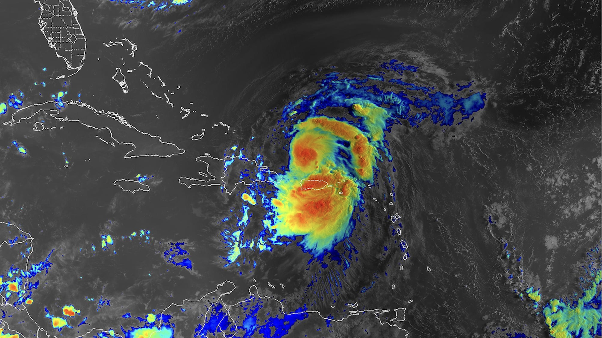 Satellite view of tropical Storm Ernesto as it moves to the north of Puerto Rico, bringing heavy rains to the island.