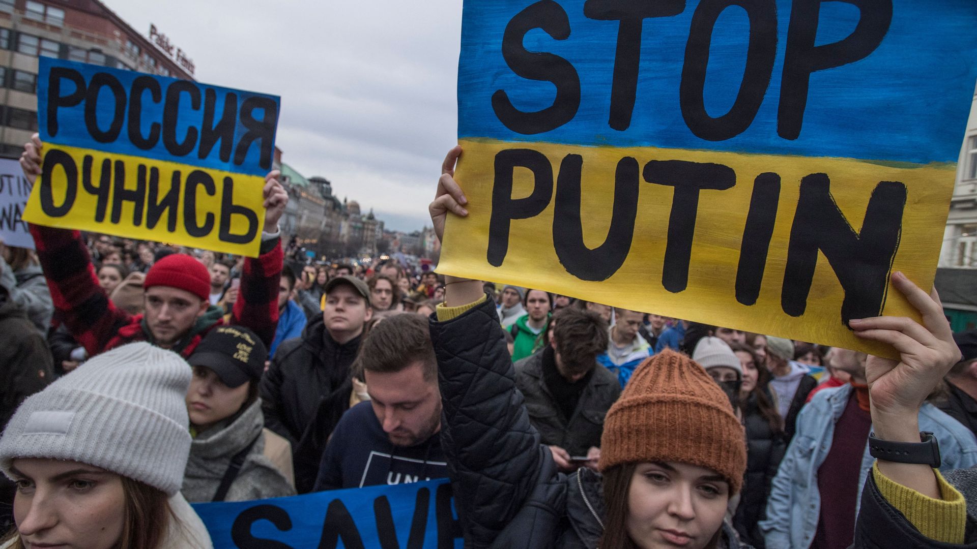 Pro-Ukraine demonstrators hold Ukranian flags and placards during a demonstration in support to Ukraine at the Venceslas square in Prague, Czech Republic on February 24.
