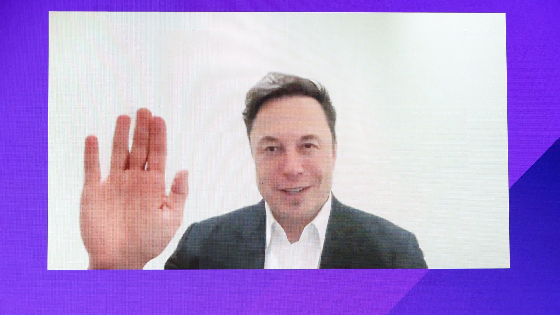 Elon Musk appears via video in Doha today.