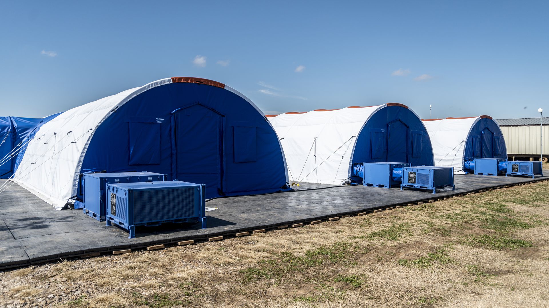  Intensive care tents sit in a row at a Influx Care Facility (ICF) for unaccompanied children Carrizo Springs, TX.