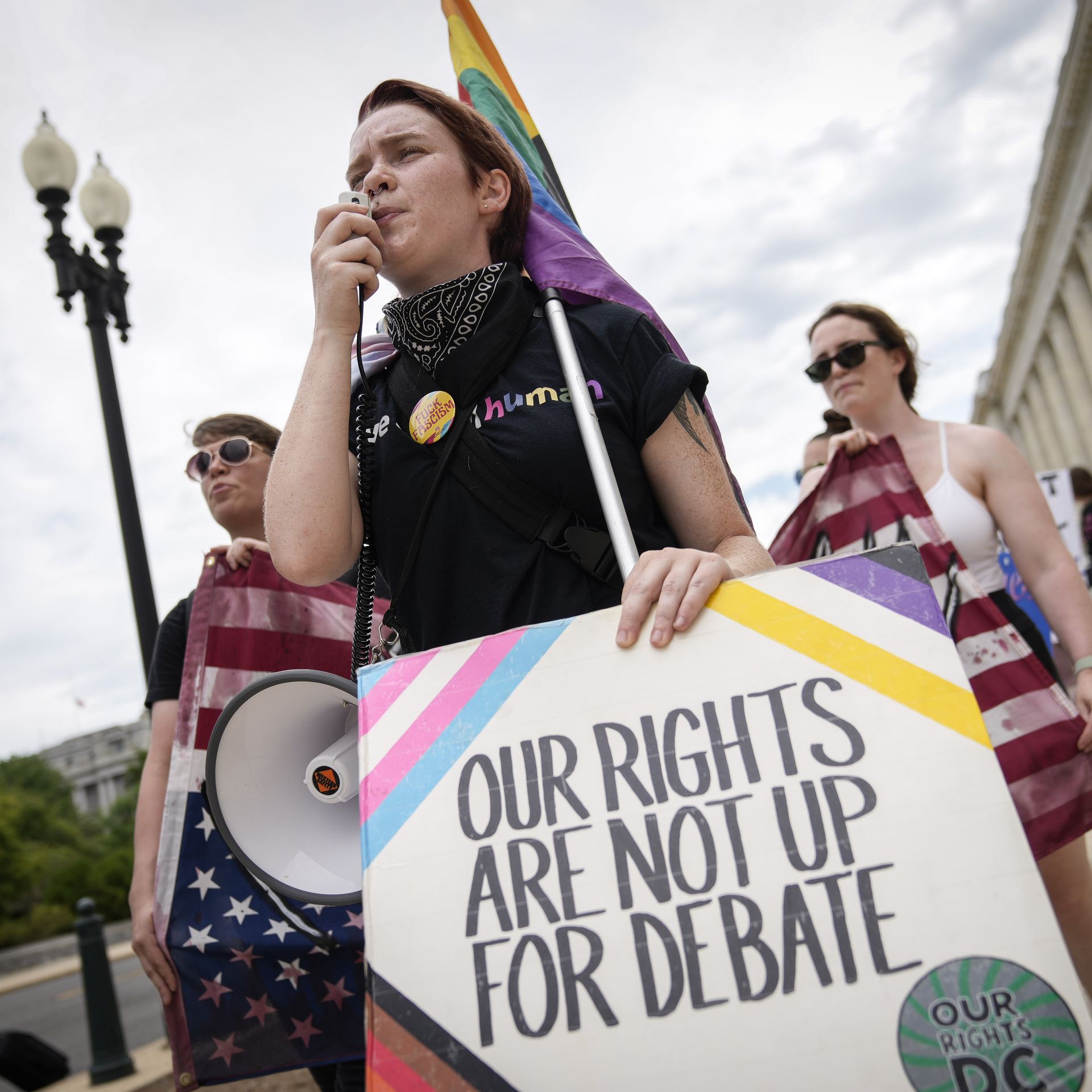 A small group of abortion rights activists march from the U.S. Supreme Court to the House of Representatives office buildings on Capitol Hill on July 6, 2022.