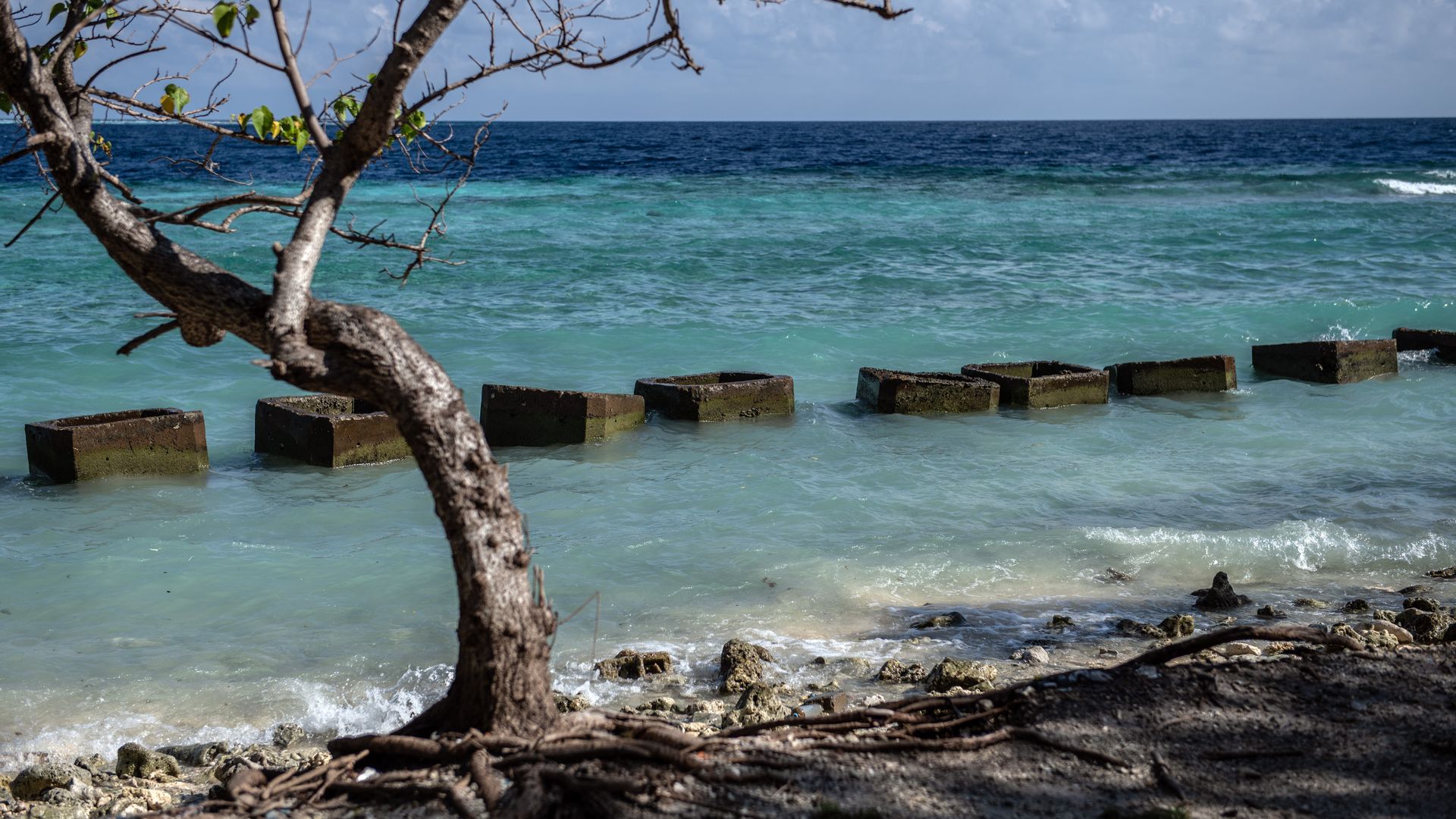 Concrete blocks are placed along the shoreline to try and prevent further coastal erosion, on December 17, 2019 in Mahibadhoo, Maldives. 