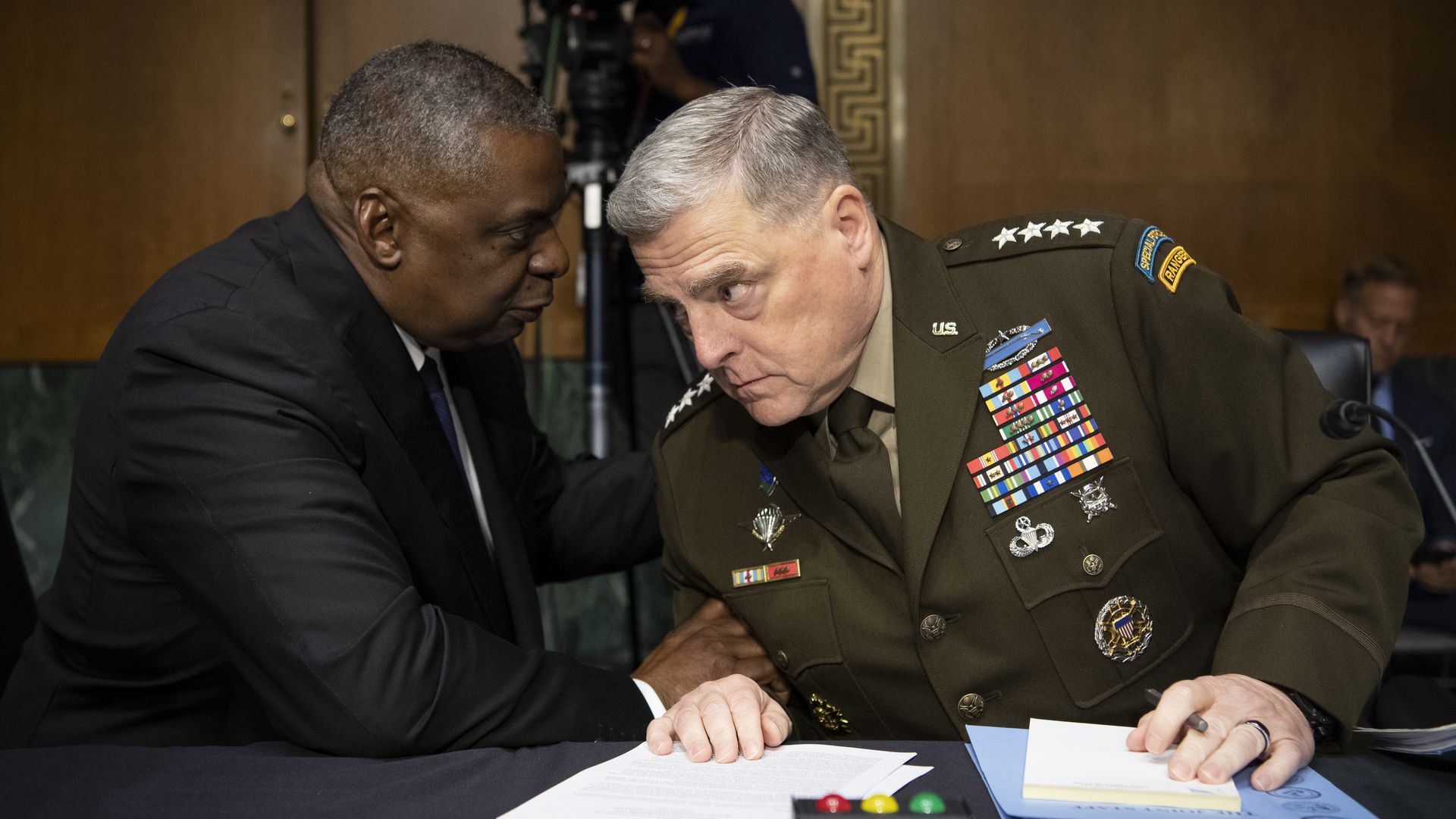 Secretary of Defense Lloyd Austin speaking with Chairman of the Joint Chiefs of Staff Gen. Mark Milley before a Senate committee hearing on June 17, 2021.