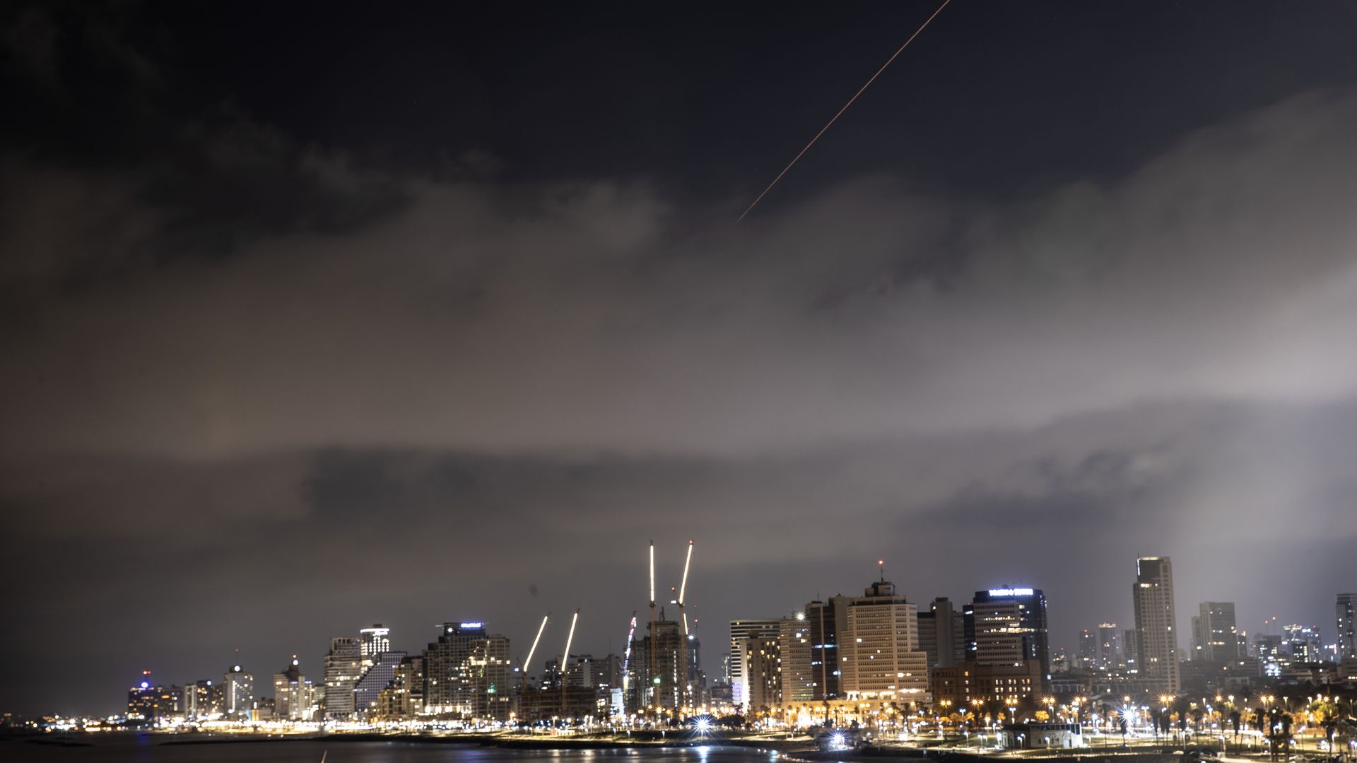 Explosions are seen in the skies of the capital, following the attack from Iran in Tel Aviv, Israel on April 14, 2024. (Photo by Mostafa Alkharouf/Anadolu via Getty Images)