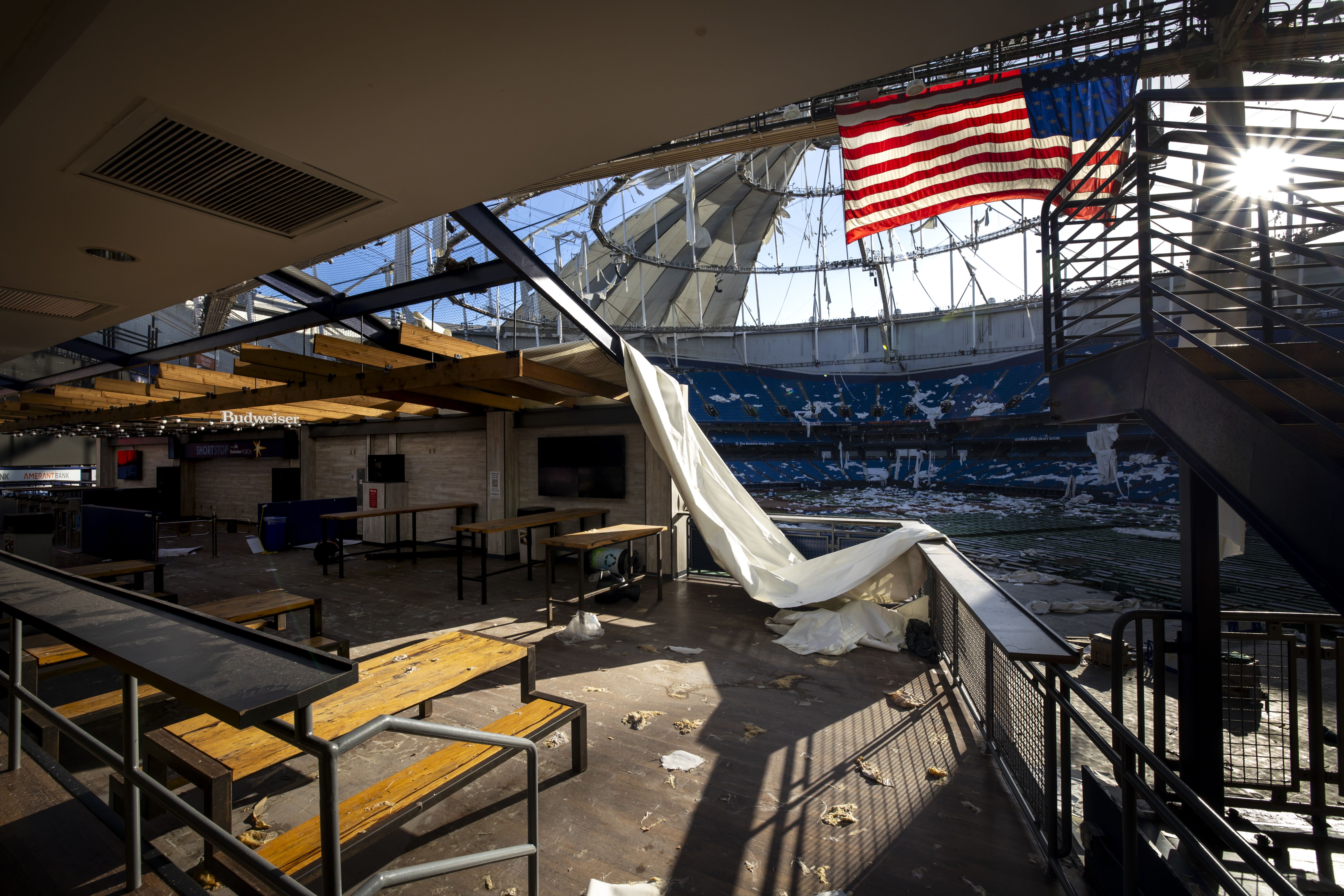 An interior view of the debris-strewn Tropicana Field after Hurricane Milton.
