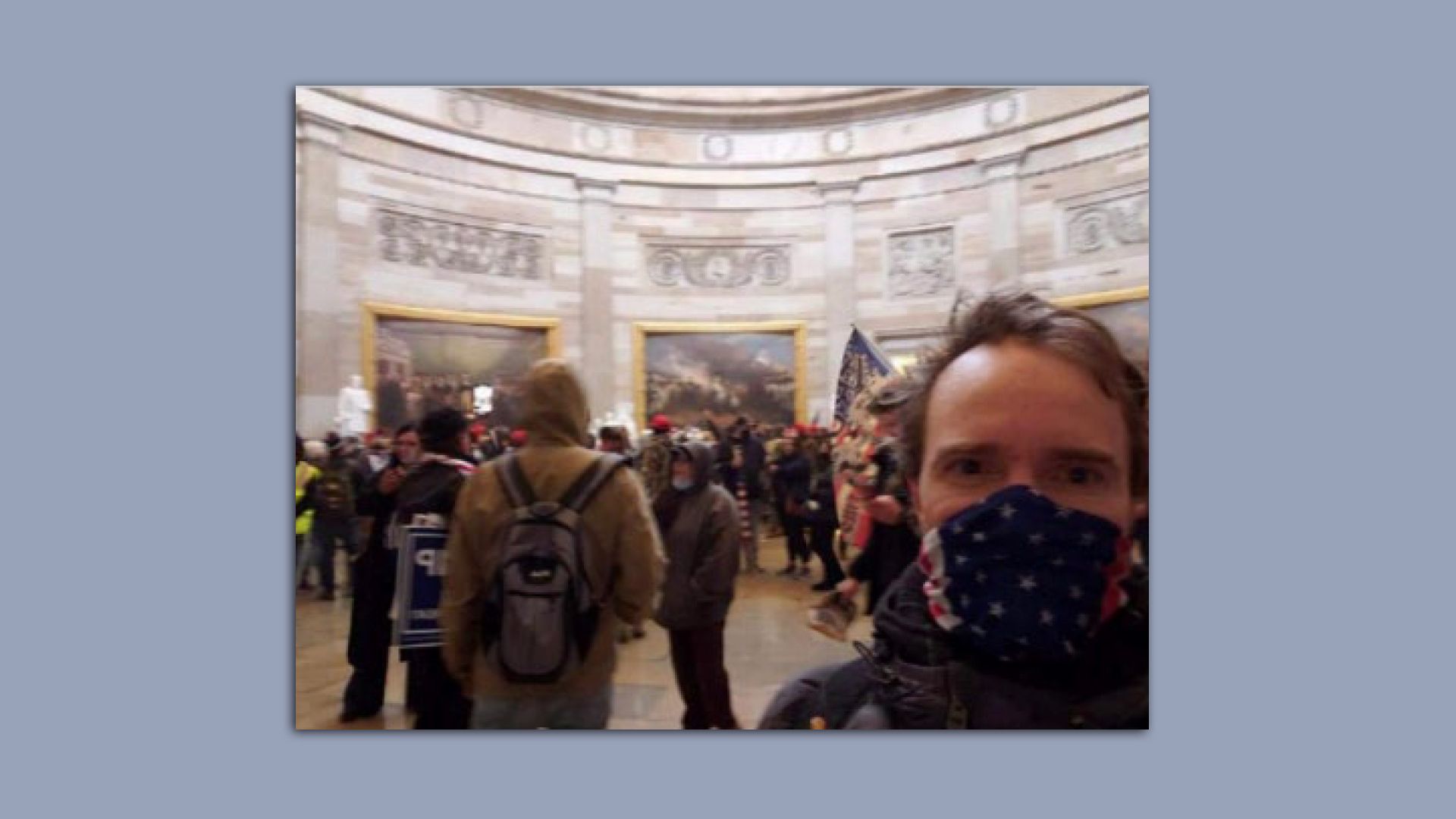 Photo of man wearing face mask inside the U.S. Capitol on January 6, 2021.