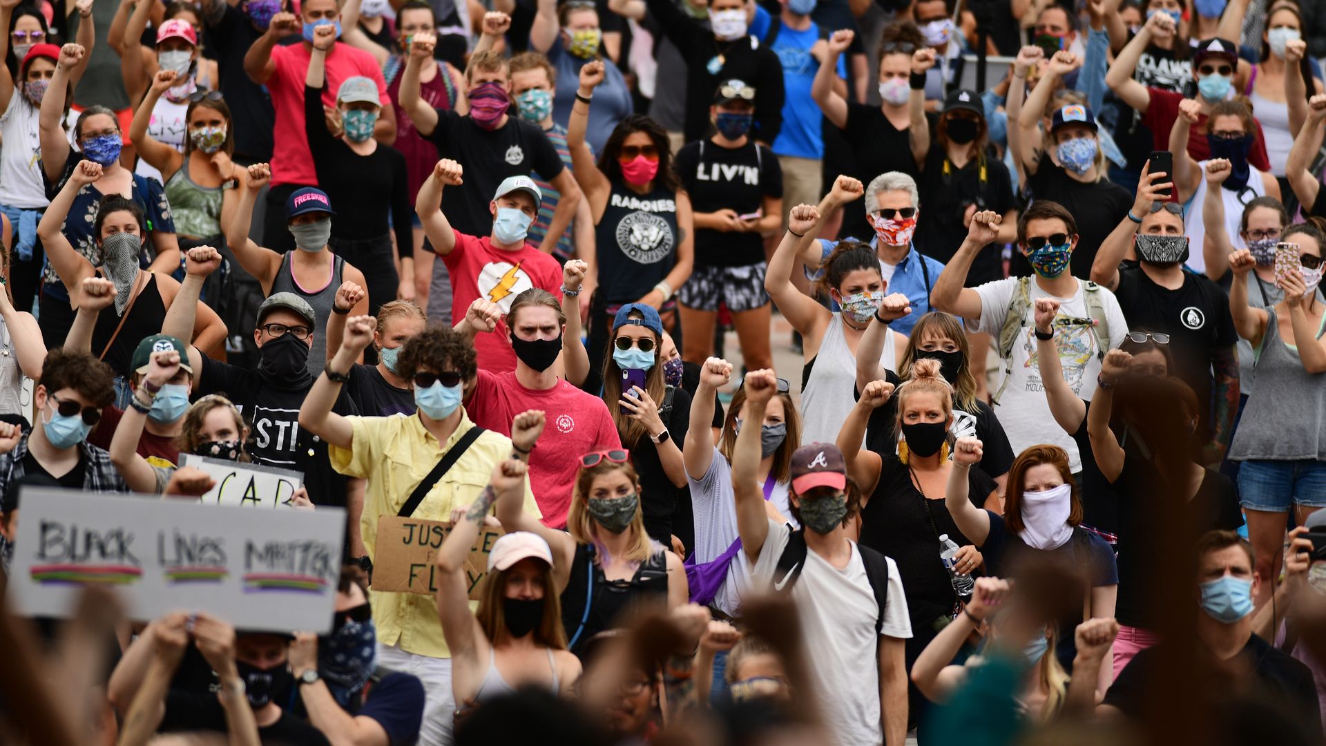 Protesters march out of Civic Center Park in Denver