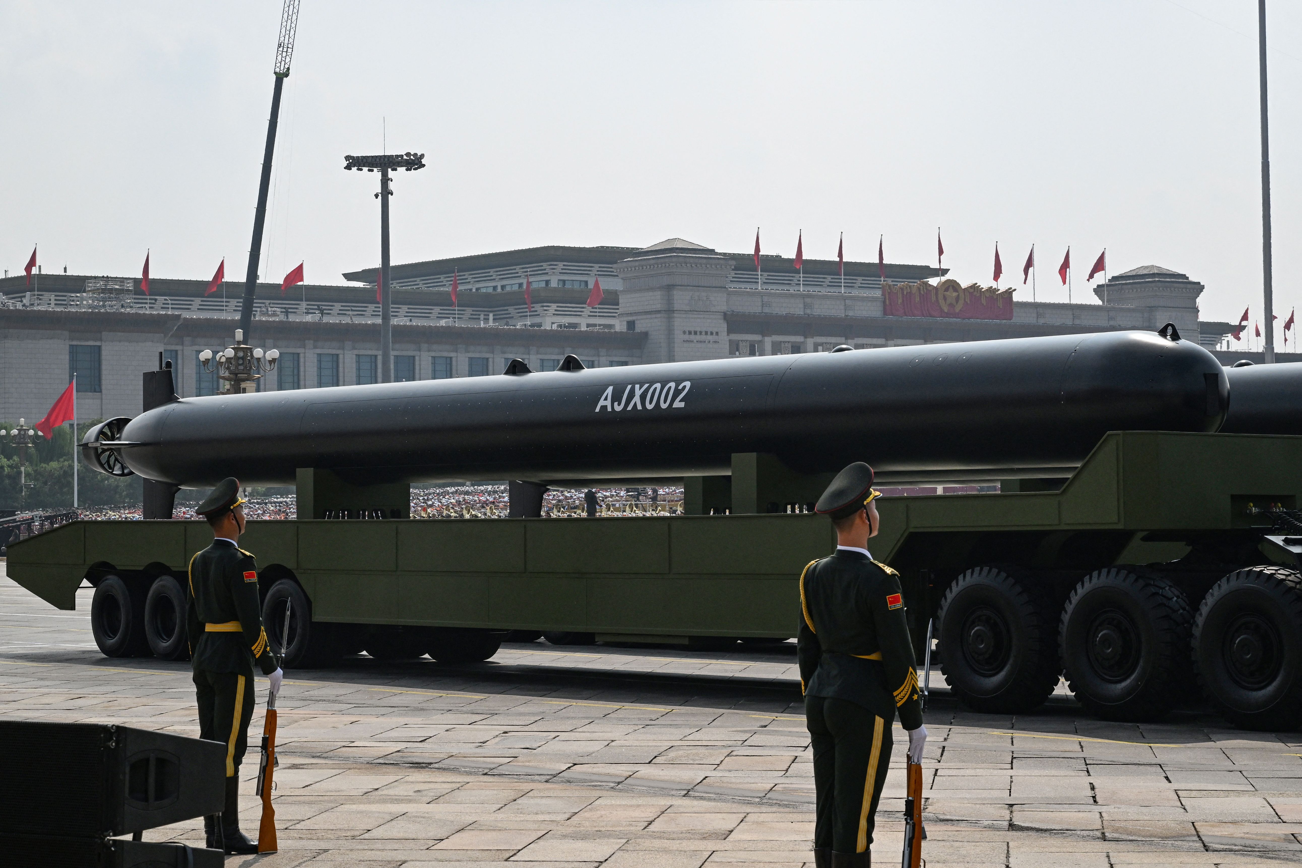 Large missile-looking thing on a truck.