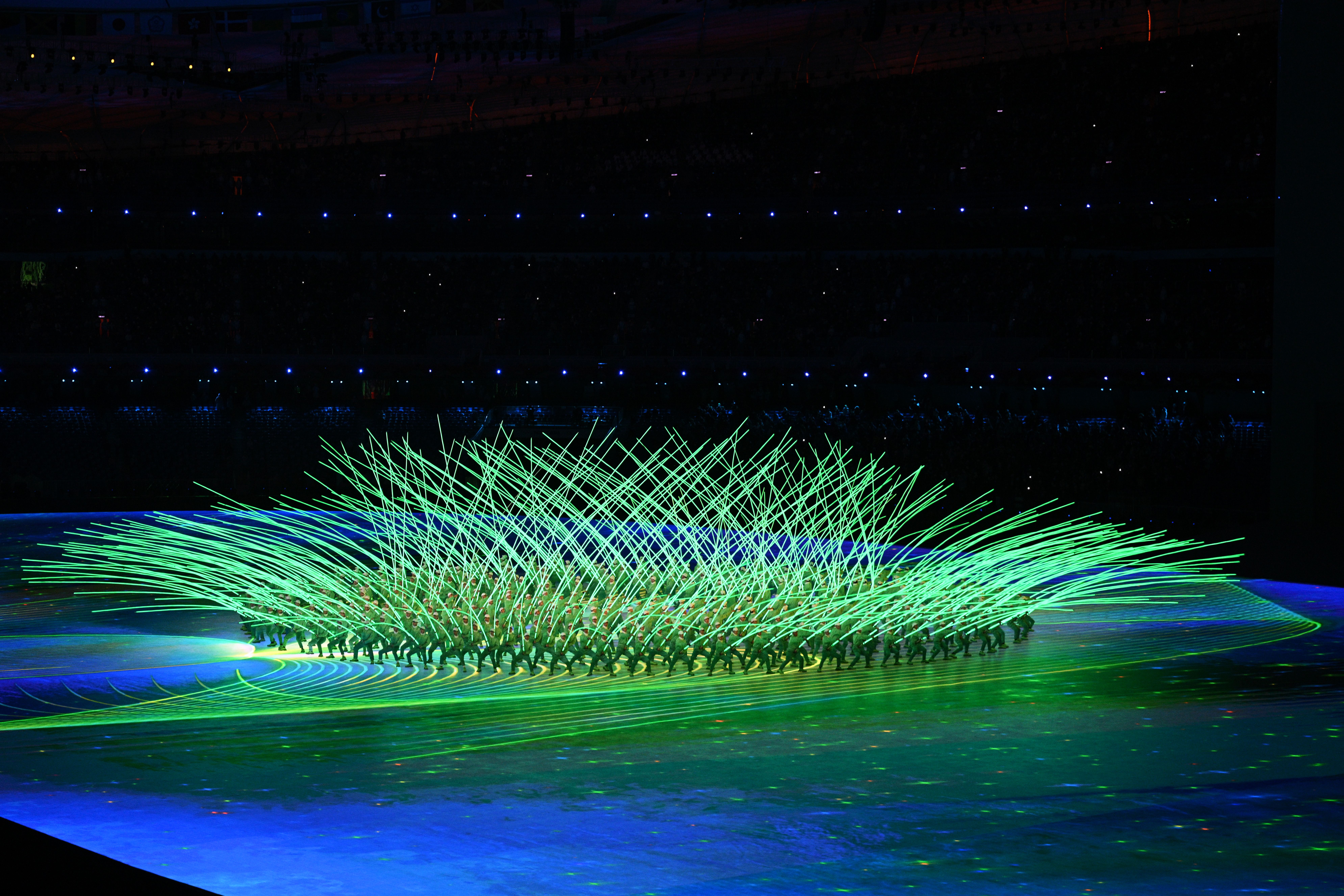 Performers create a flower display with LED lights during the Opening Ceremony of the Beijing 2022 Winter Olympics.