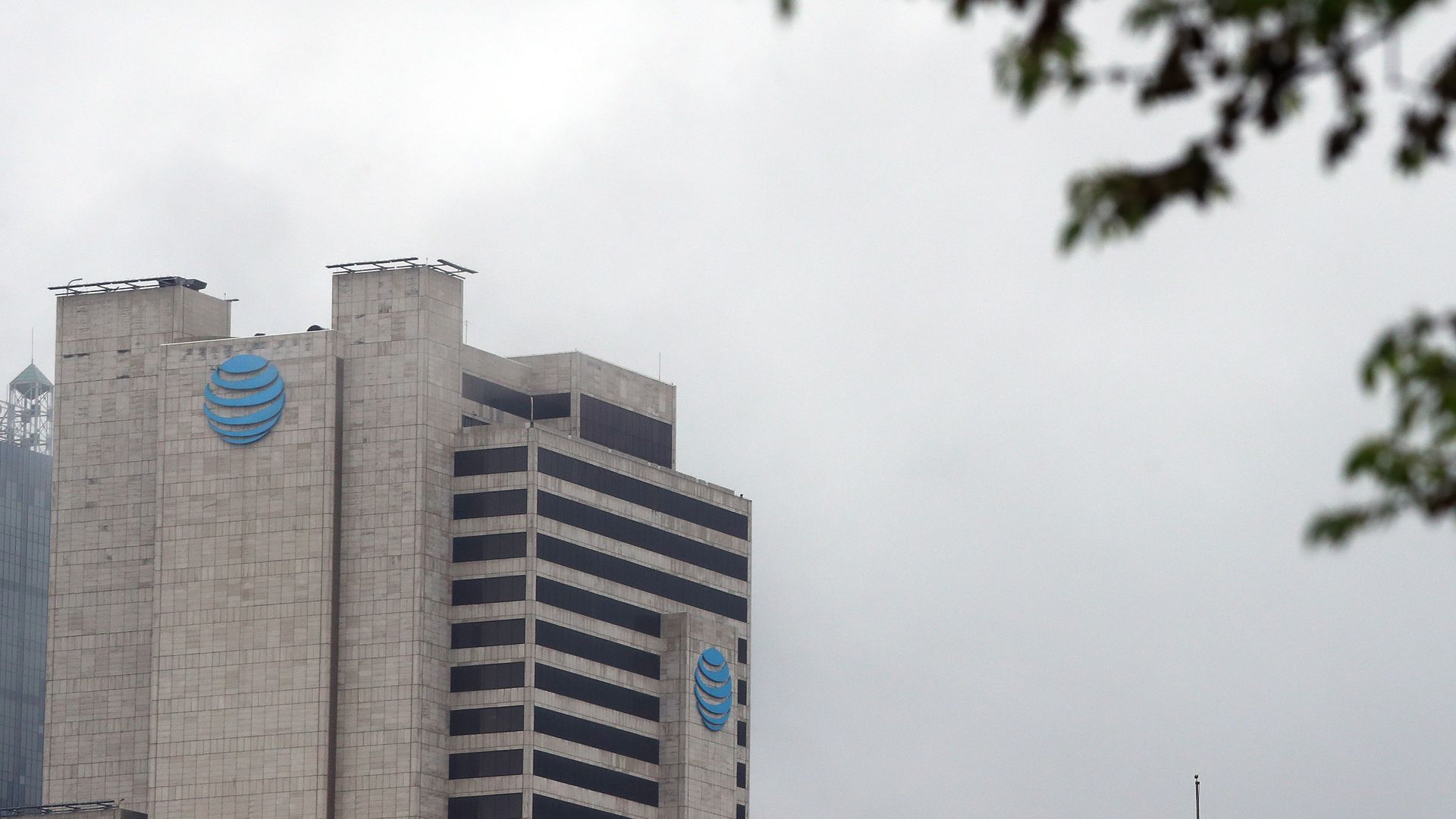 A tall building with a blue AT&T logo toward the top