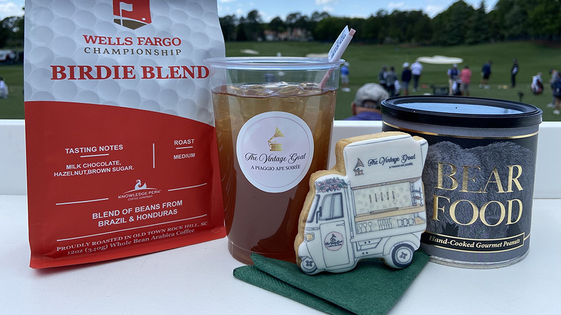 Knowledge Perk Coffee, an Arnold Palmer and sugar cookie from The Vintage Goat and gourmet peanuts from Bear Food. Photo: Ashley Mahoney/Axios