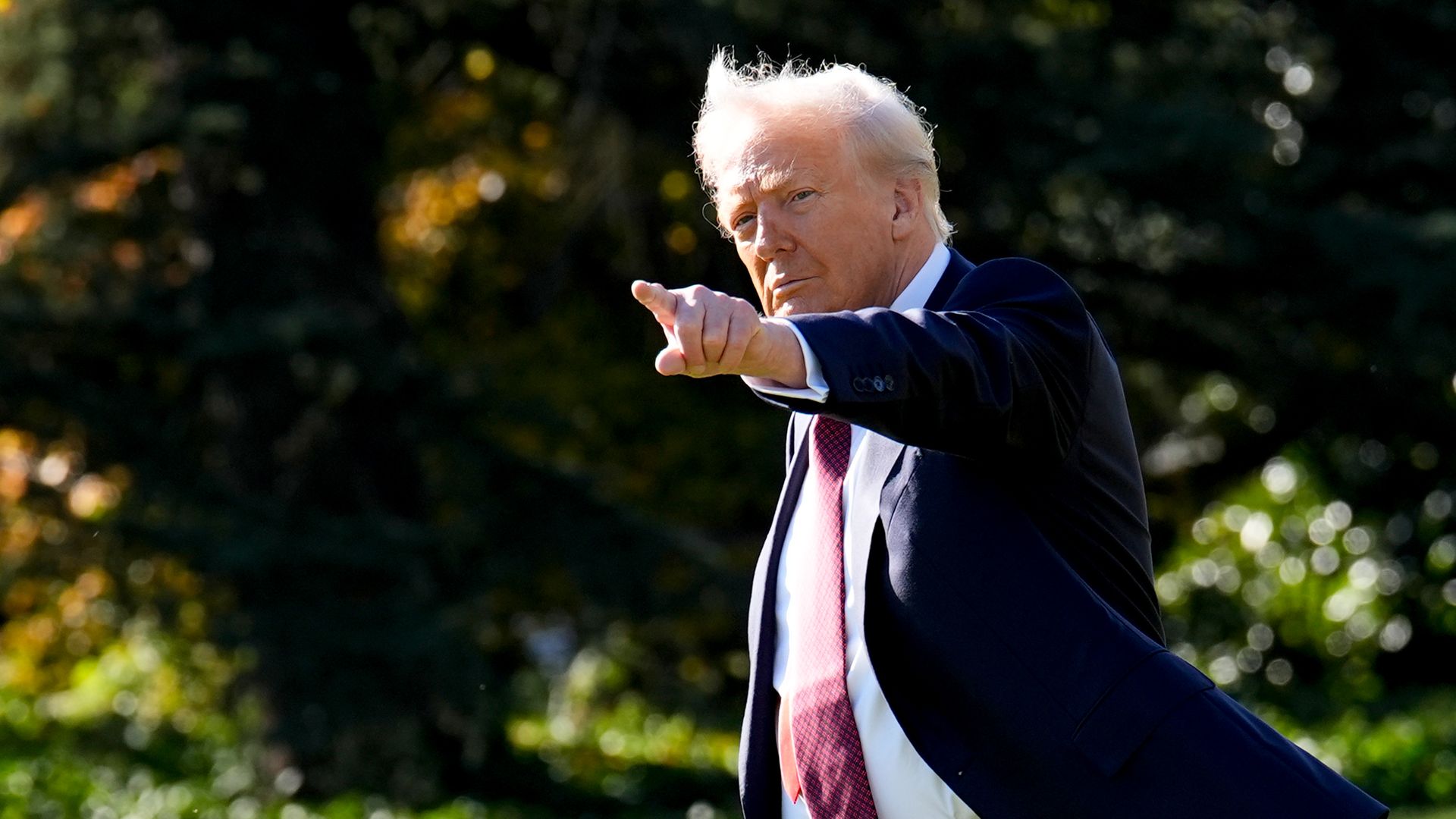 President Donald Trump walks on the South Lawn of the White House before boarding Marine One 