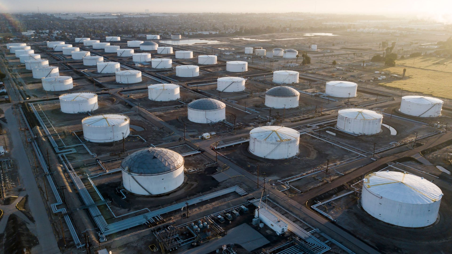  Oil-storage tanks are seen from above in Carson, California, April 25