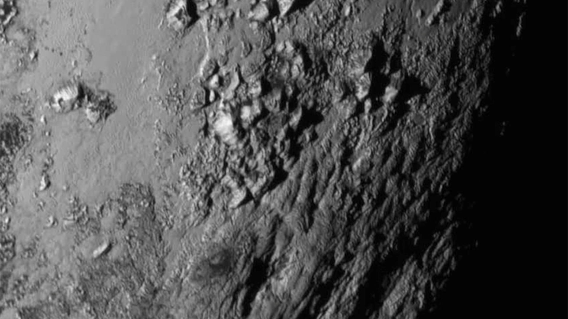 The icy mountains of Pluto seen in black and white