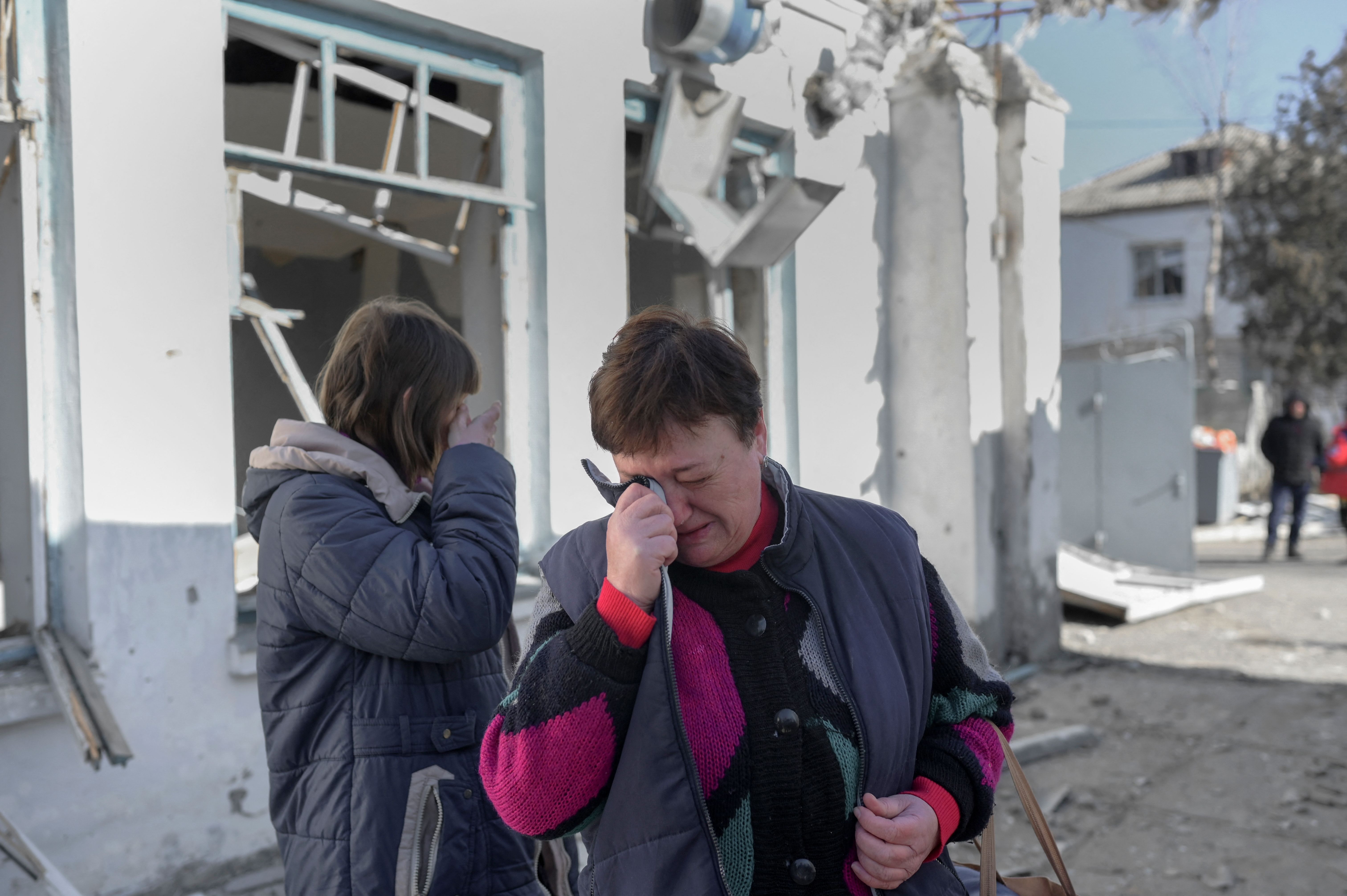  Nurses cry as they arrive to see their hospital after Russian shelling hit the mental hospital of Mykolaiv, southern Ukraine, on March 22.