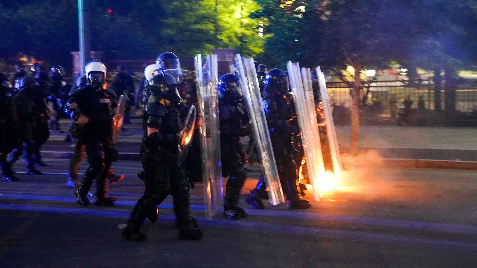 Police officers advance after firing tear gas during a demonstration on May 31, 2020 in Atlanta, Georgia.