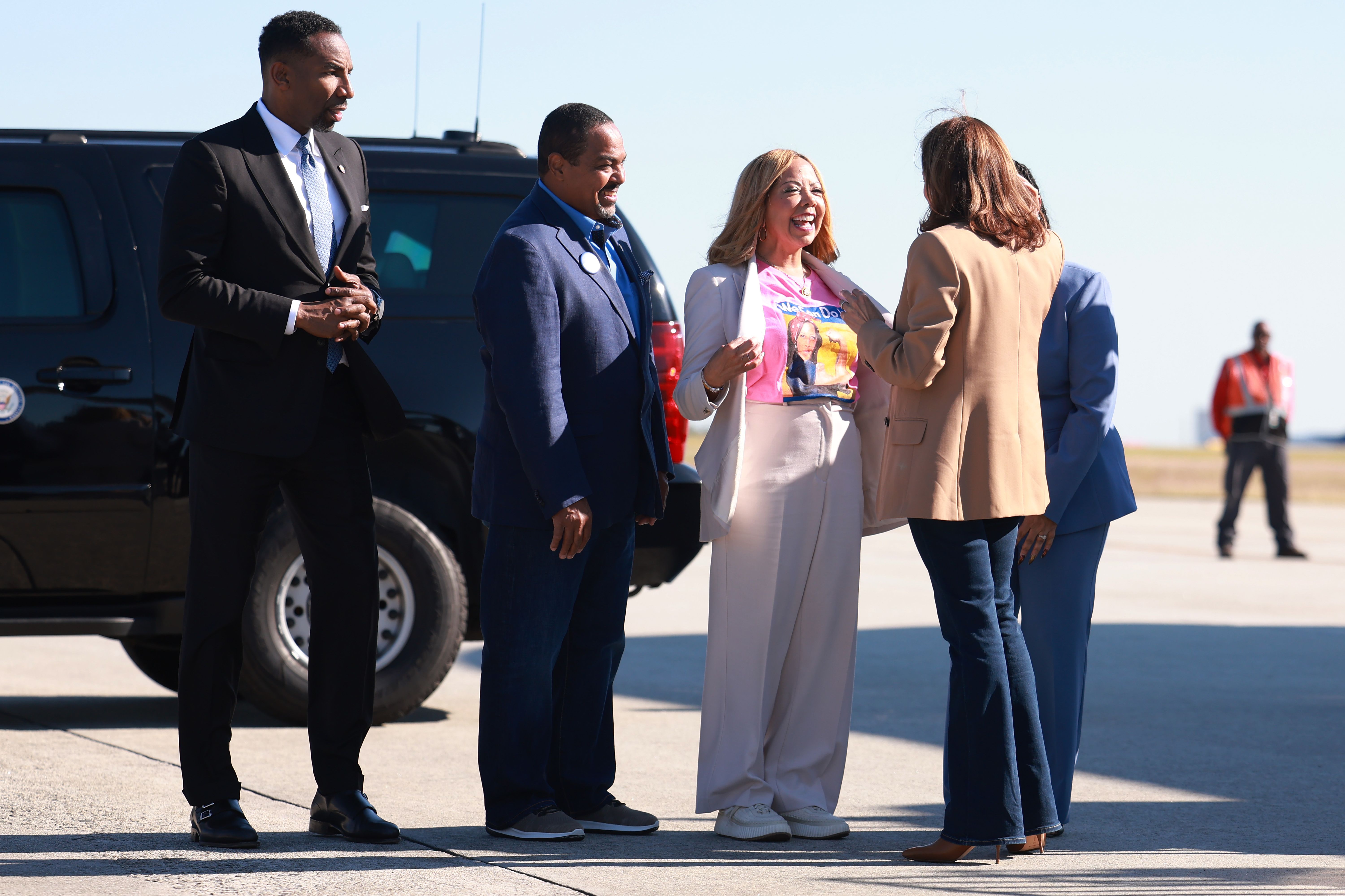 ATLANTA, GEORGIA - OCTOBER 24: (L-R) Mayor of Atlanta Andre Dickens, Curtis McBath and U.S. Rep. Lucy McBath (D-GA) greet Rep. Democratic presidential nominee, U.S. Vice President Kamala Harris as she arrives at the Hartsfield–Jackson Atlanta International Airport on her way to a campaign event with