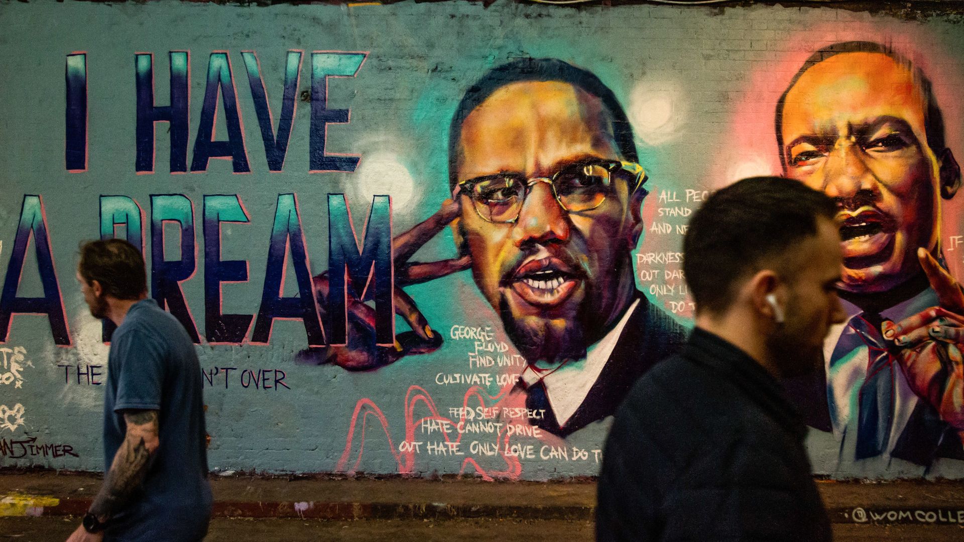Photo of a mural showing Malcolm X and MLK speaking